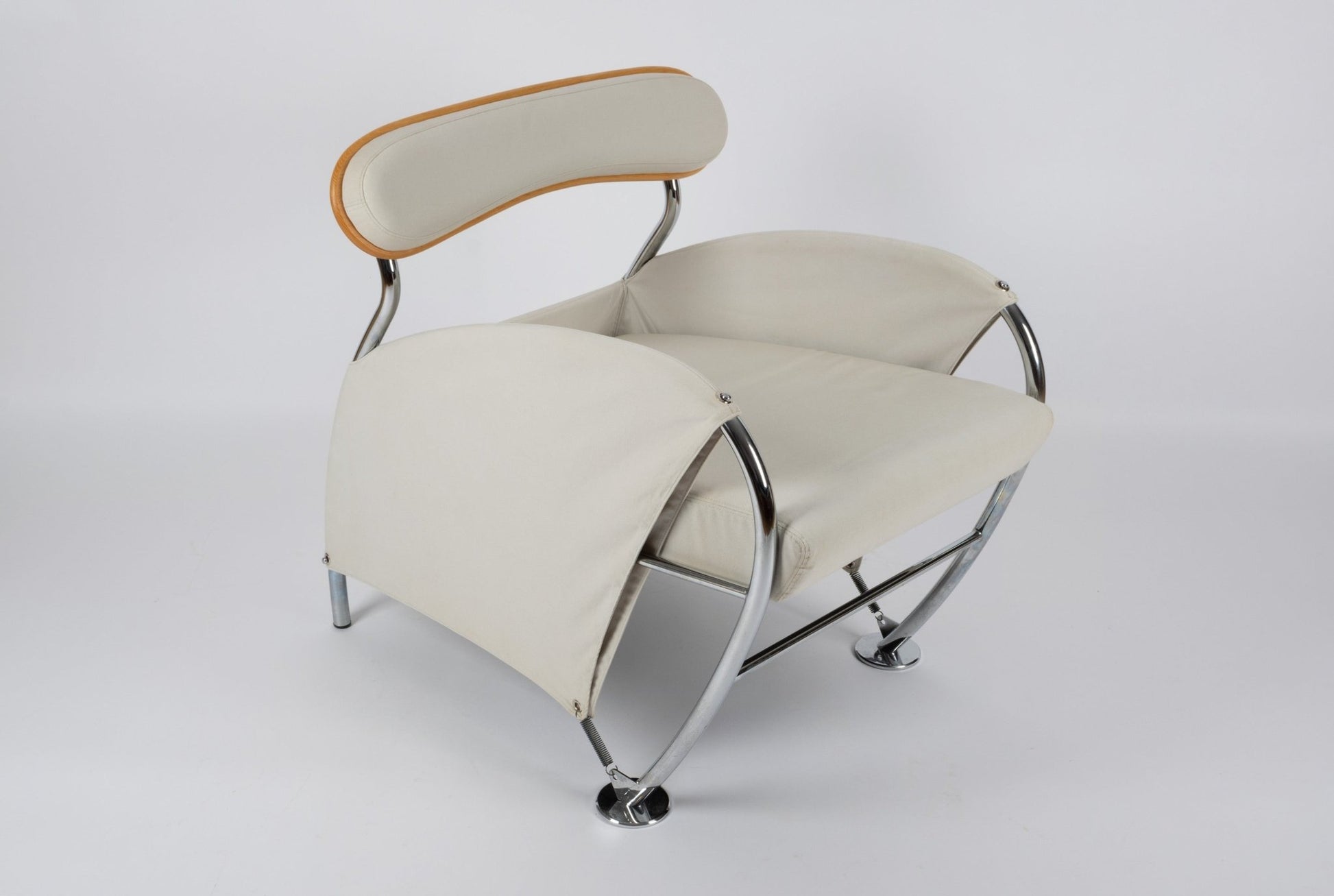 Pair of Massimo Iosa Ghini Memphis-style arm chairs from 1980s Italy with chrome frame and cream canvas upholstery.