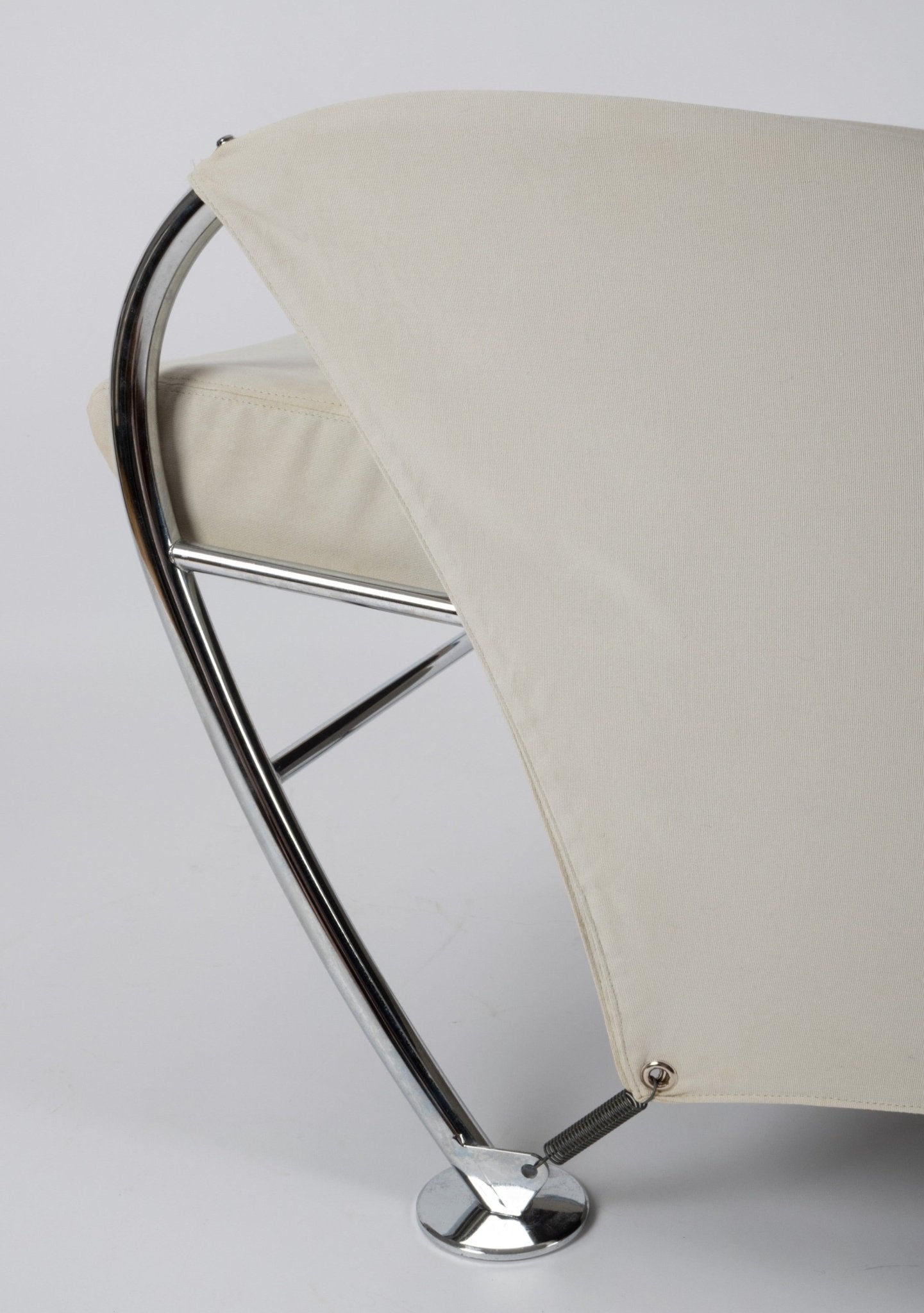 Close-up of Massimo Iosa Ghini 1980s Memphis-style arm chair with cream canvas and chrome frame detail