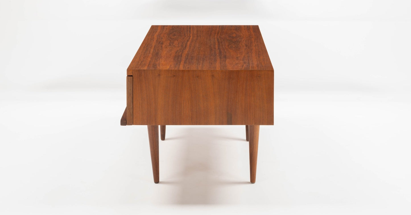 Pair of mid-century modern walnut side tables with rectangular tops, single front drawers, and tapered legs