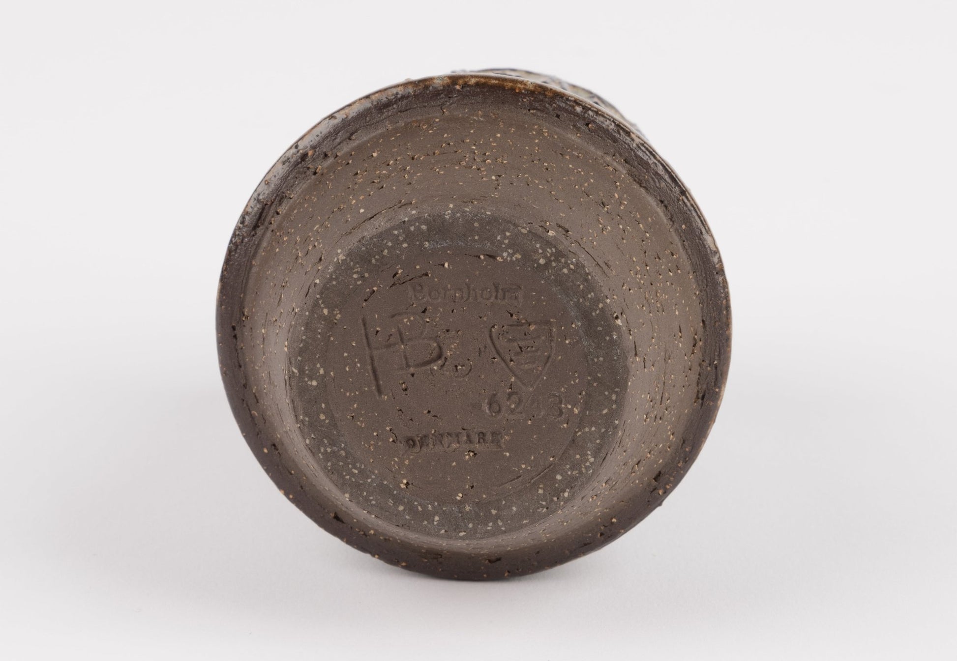 Bottom view of Michael Andersen stoneware vase showing maker's mark and textured ceramic base