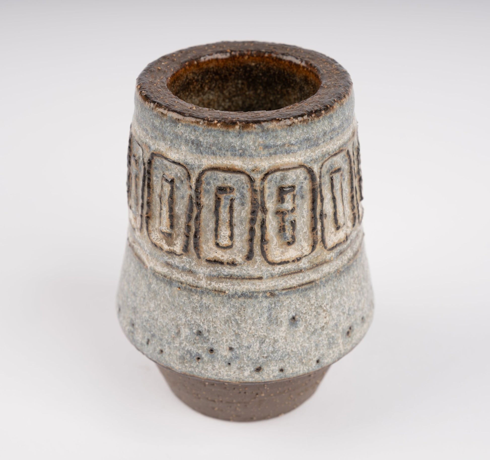 Michael Andersen stoneware vase with carved geometric relief band and textured blue-gray glaze on brown base