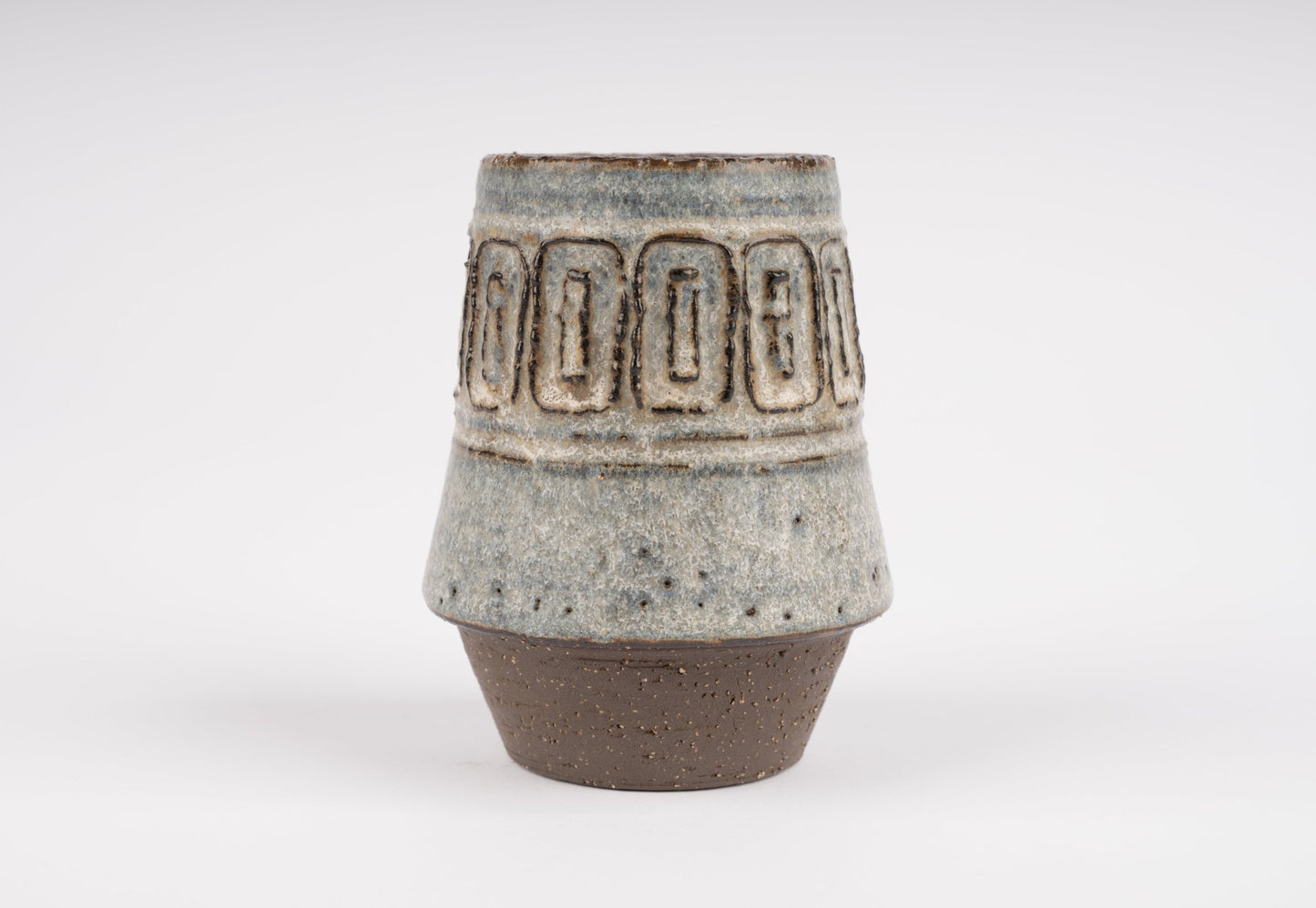 Michael Andersen stoneware vase with carved geometric band and textured glaze on tapered brown ceramic base