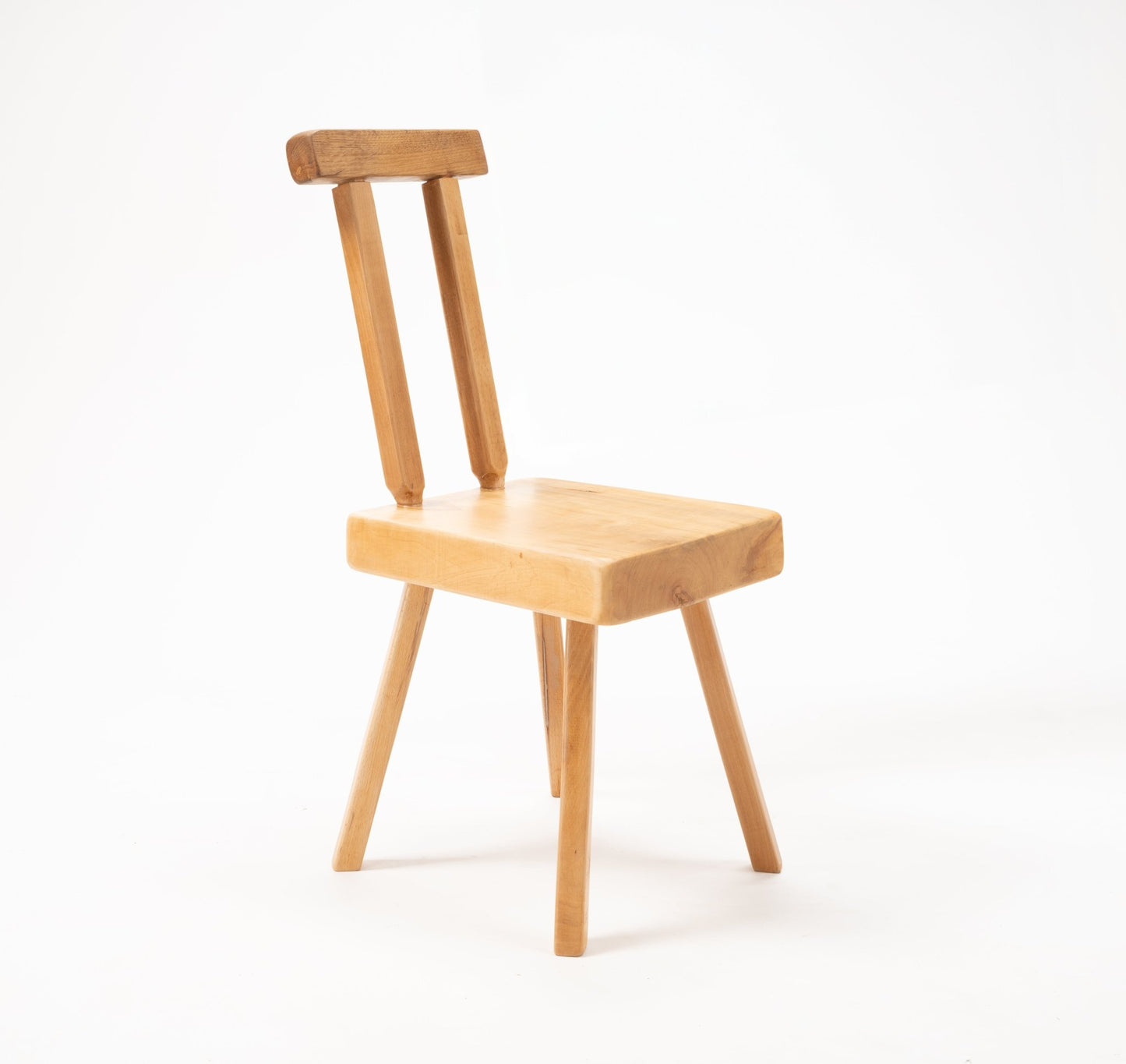 Mobichalet Brutalist pine chair with angled legs and minimalist backrest, Belgian mid-century design on white background