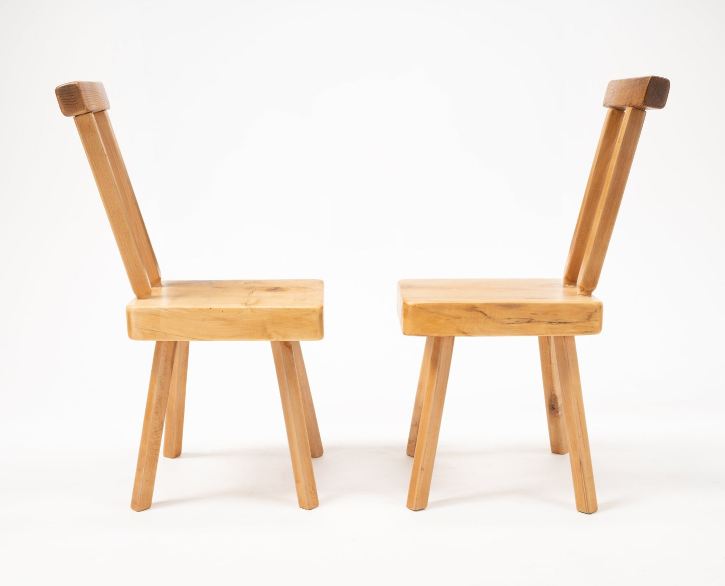 Pair of Mobichalet Brutalist oversized pine chairs with angled backrests and solid block seats on white background