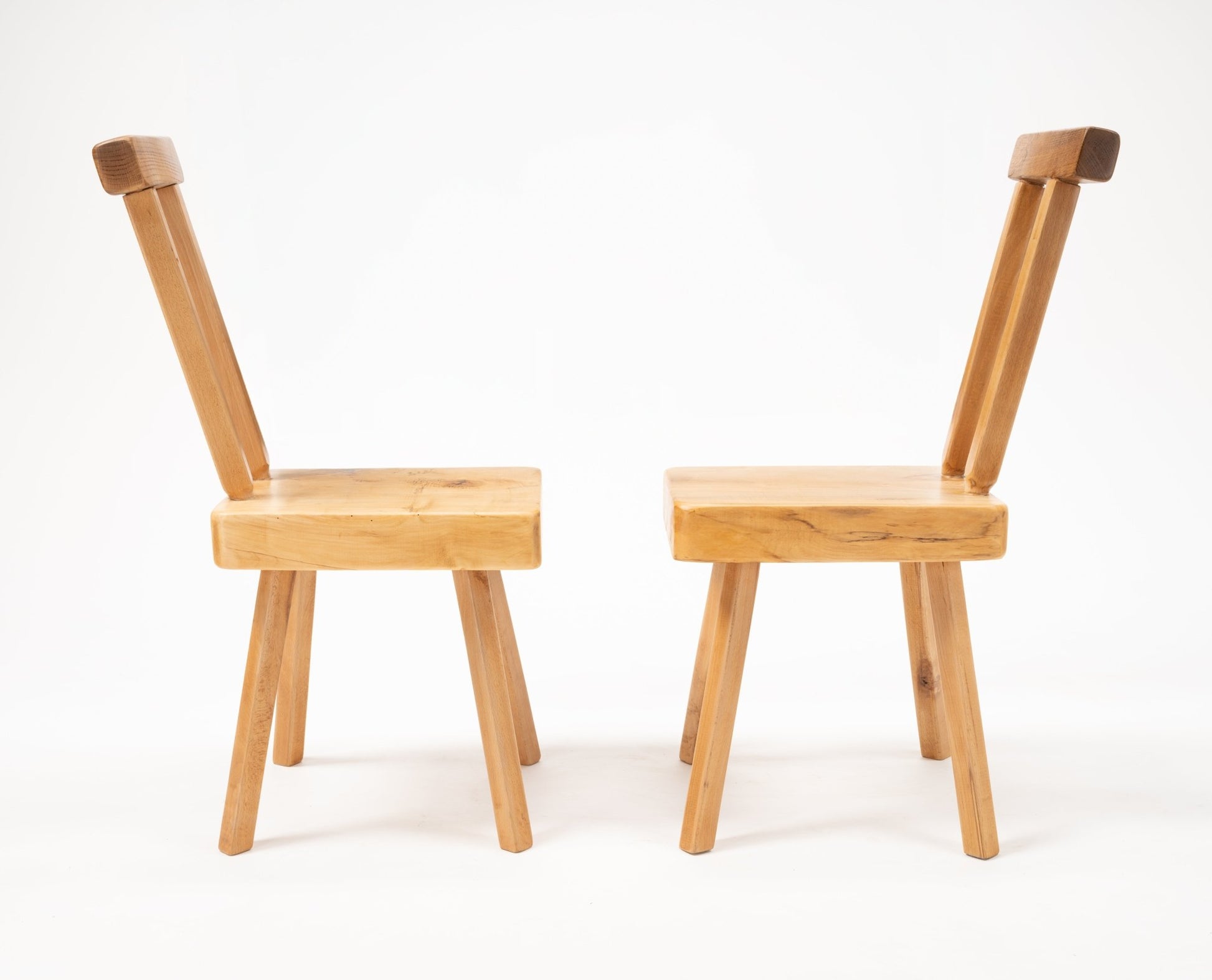 Pair of Mobichalet Brutalist oversized pine chairs with angled backrests and solid block seats on white background