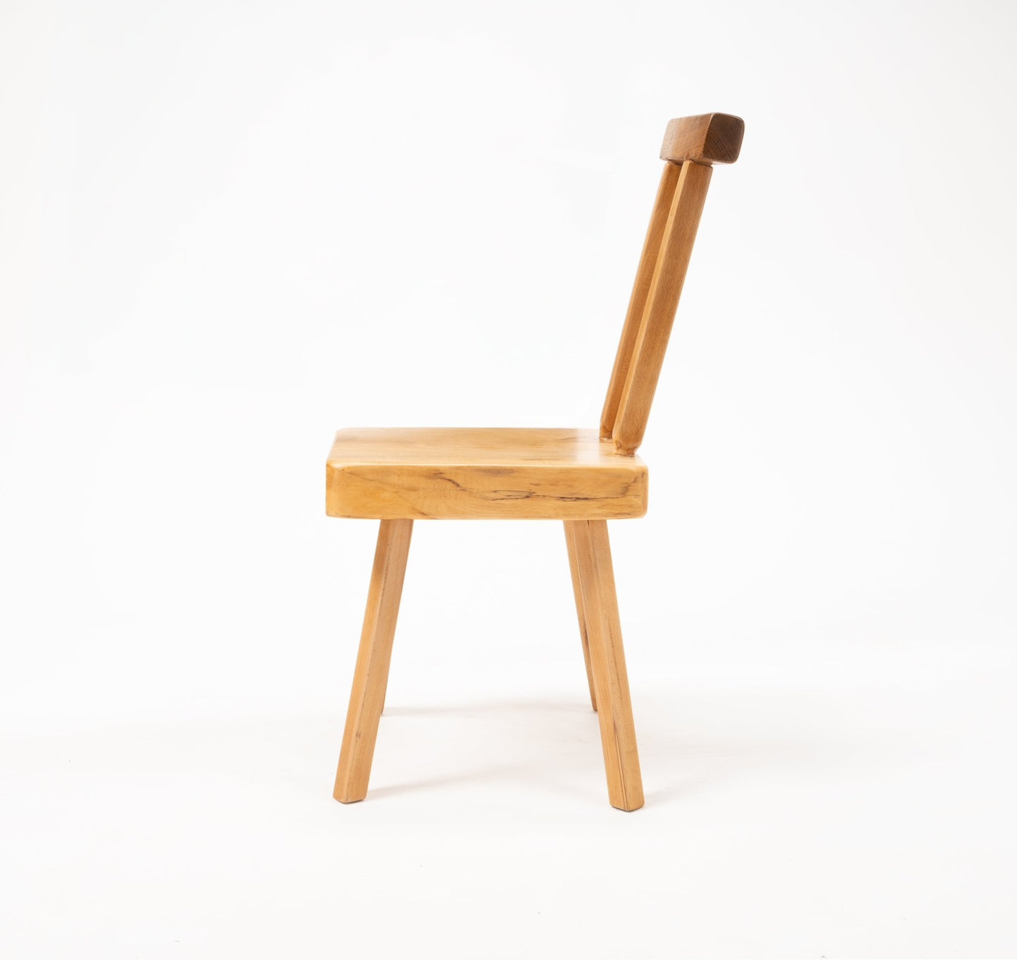Side view of Mobichalet Brutalist oversized pine chair with thick seat and angled backrest on white background