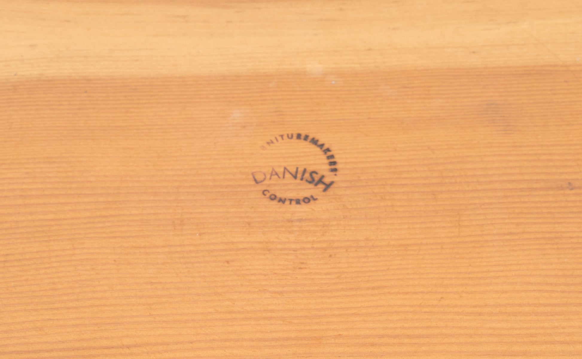 Close-up of Danish Furnituremakers Control stamp on Oregon pine surface of Nanna Ditzel Pine Table