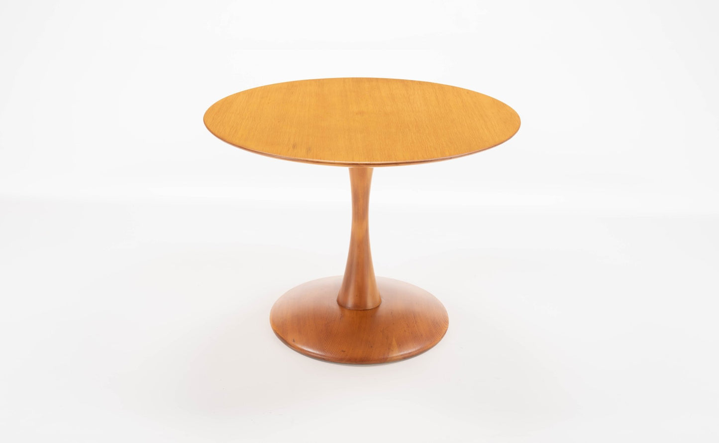 Nanna Ditzel Pine round table with tapered central pedestal and smooth circular base in mid-century modern style