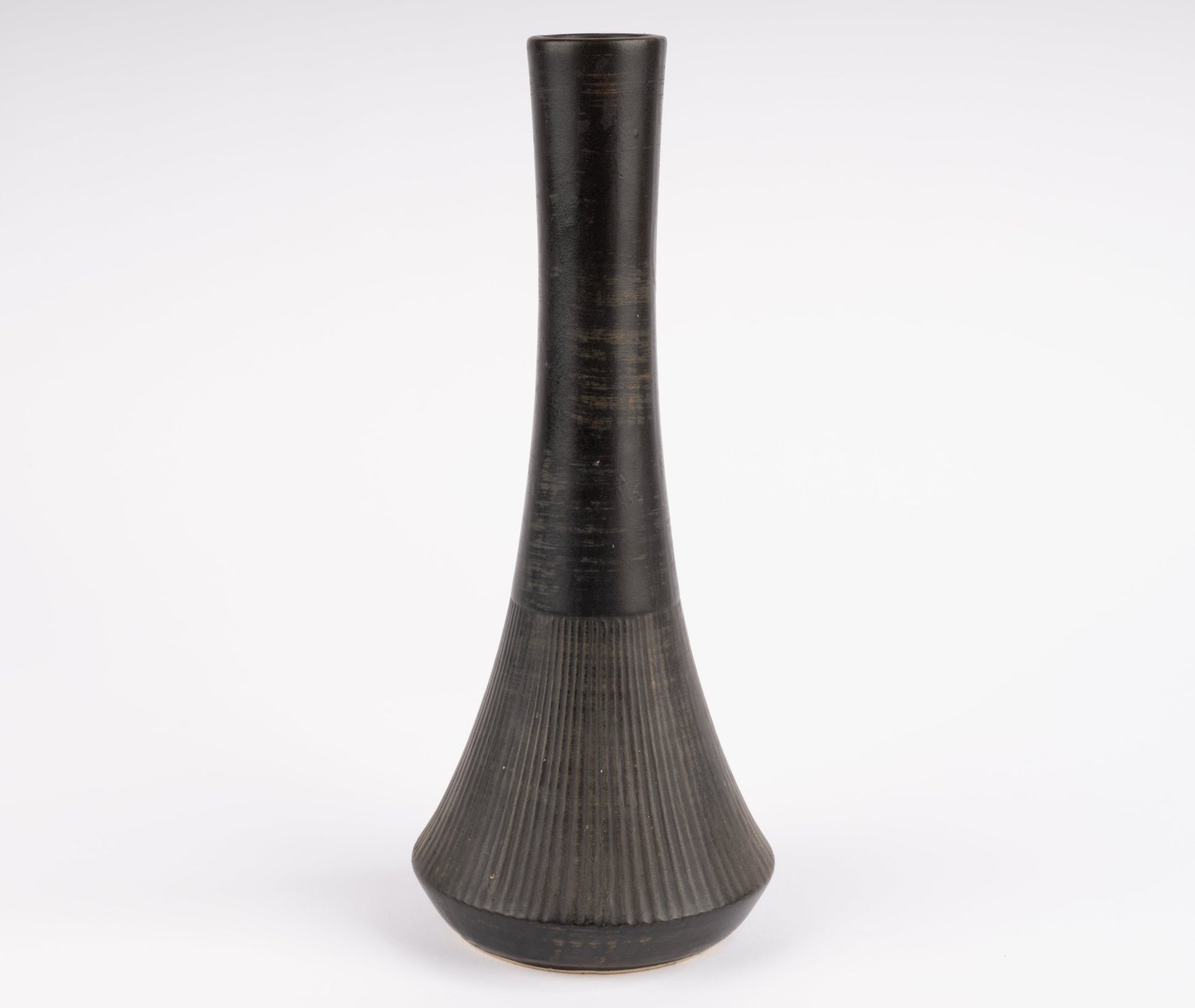 Tall Nelson McCoy pottery vase with slender neck and flared base finished in deep charcoal black glaze
