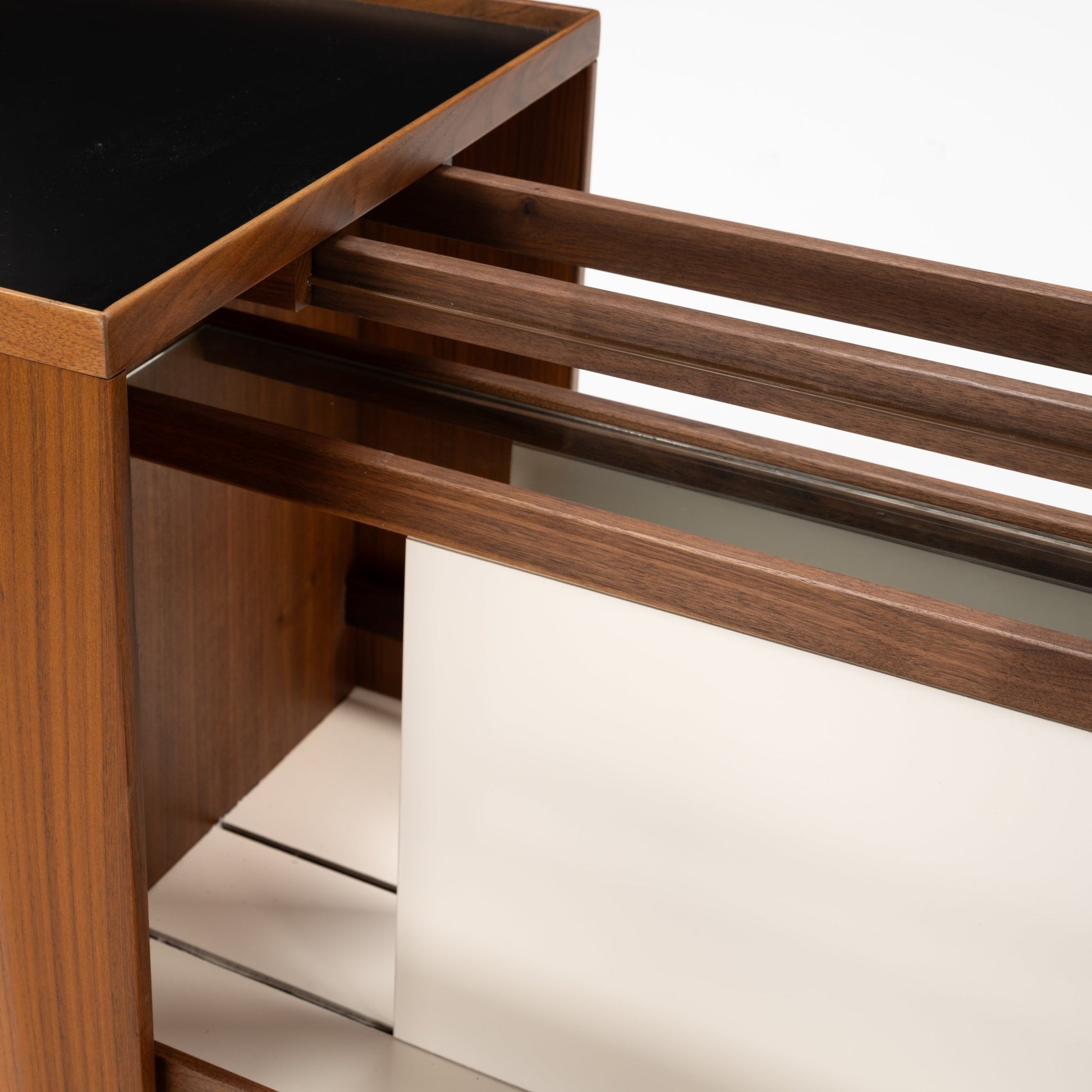 Niels Erik & Glasdam Jensen Teak Expanding Bar Cart featuring a close-up view of rich teak wood grain, smooth dark tray surface, and sleek expandable sides showcasing vintage Danish mid century modern storage design.