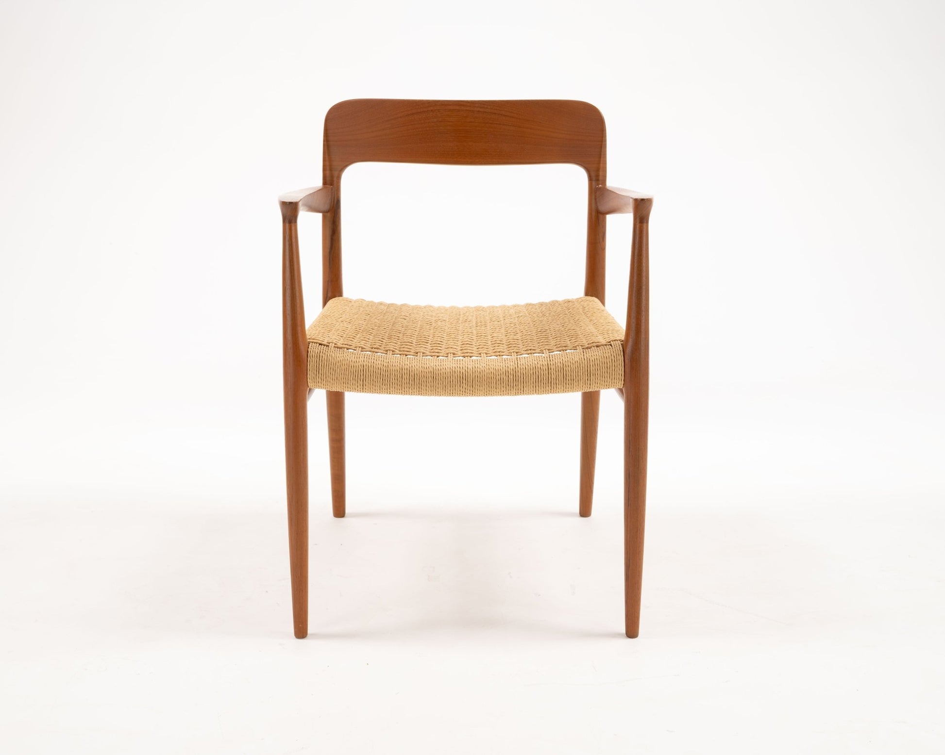 Niels Otto Moller Model 56 Danish teak dining chair with woven papercord seat and sculptural mid-century modern design