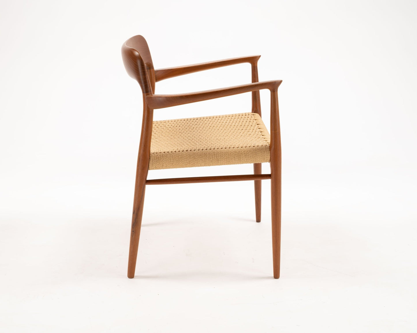 Single Niels Otto Moller teak and papercord Danish dining armchair Model 56 from the 1960s side view