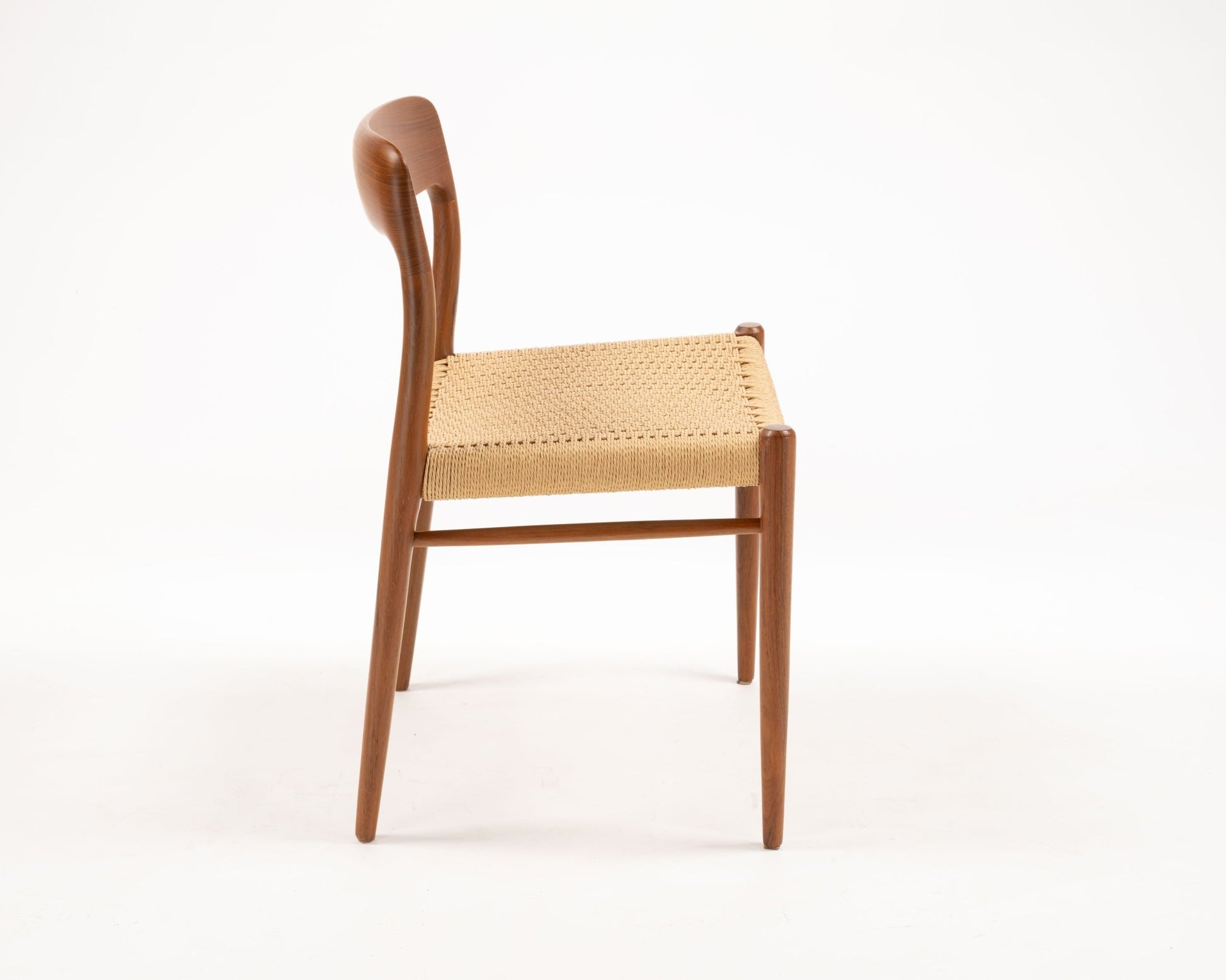Side view of Niels Otto Moller teak dining chair with woven papercord seat, Danish mid-century design from 1954.