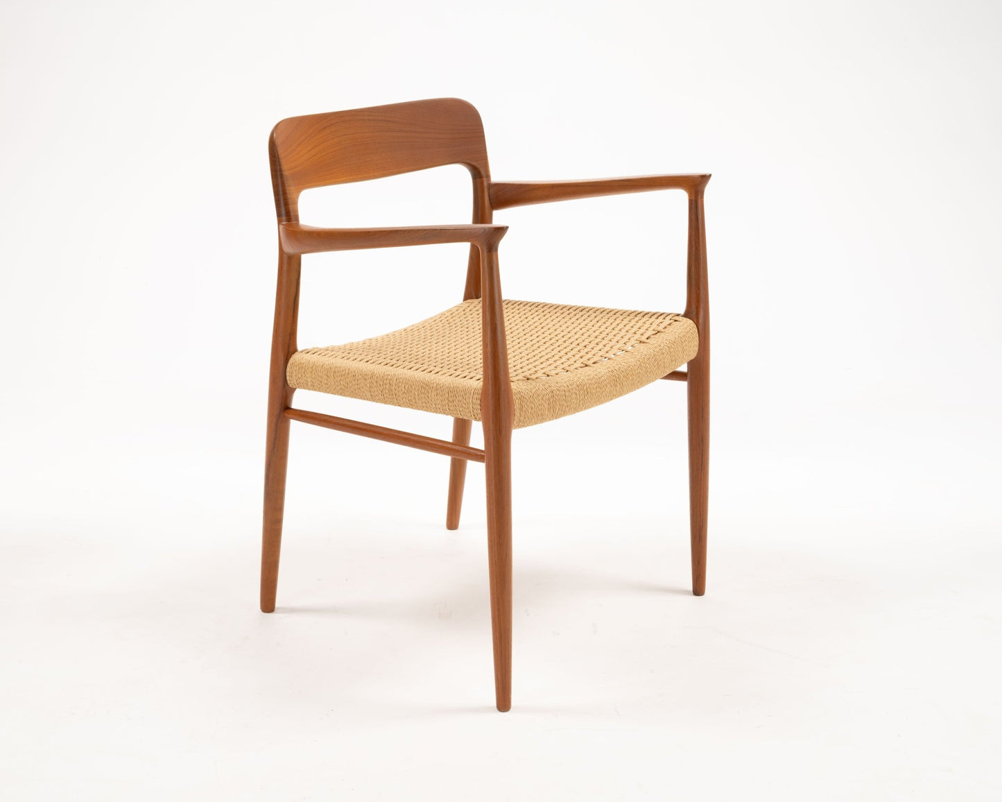 Niels Otto Moller solid teak dining chair with woven papercord seat and sculptural Danish mid-century design