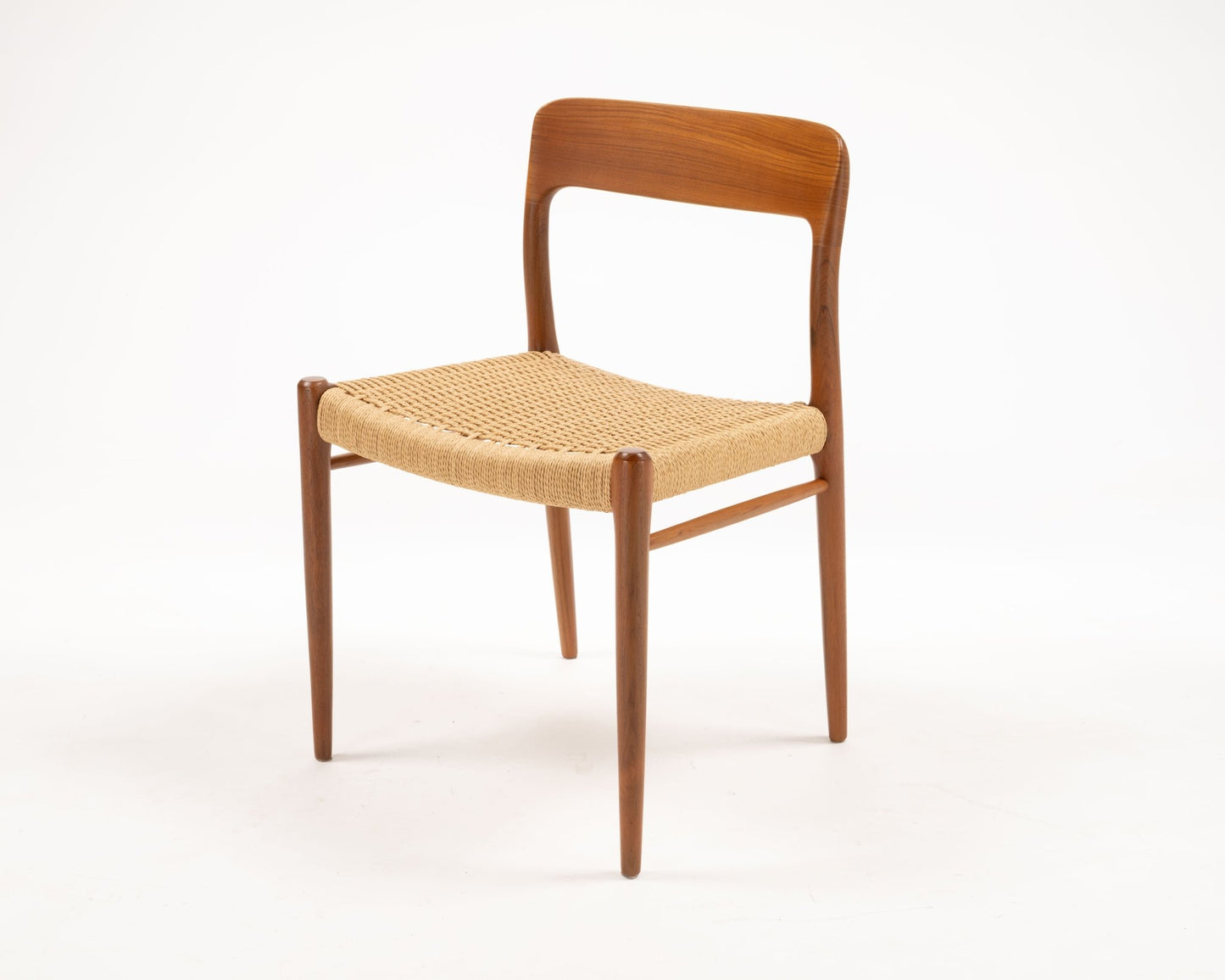 Mid-century Danish teak dining chair with woven papercord seat, designed by Niels Otto Moller in the 1950s.