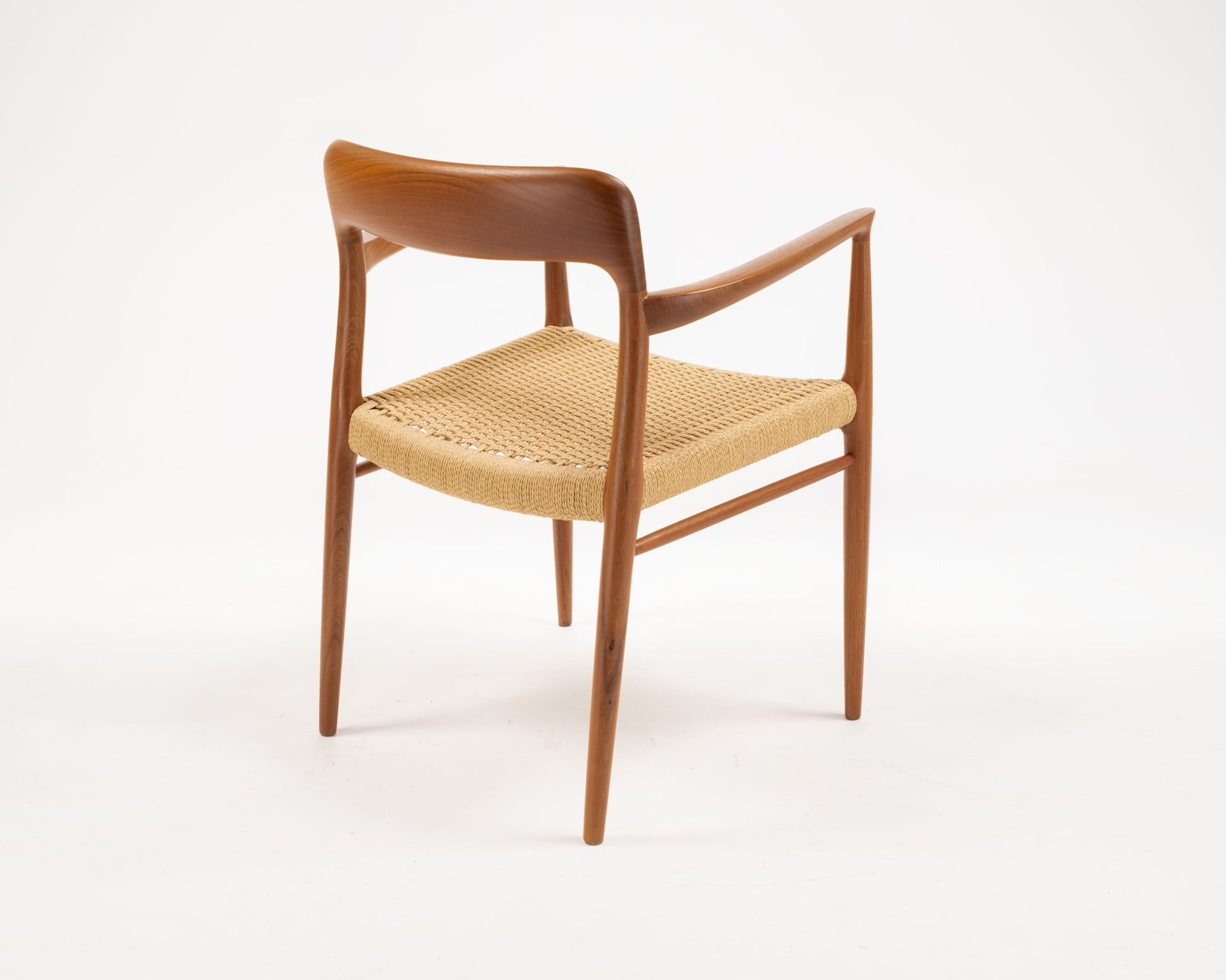 Single Niels Otto Moller Danish teak dining chair with woven papercord seat from the 1960s vintage set