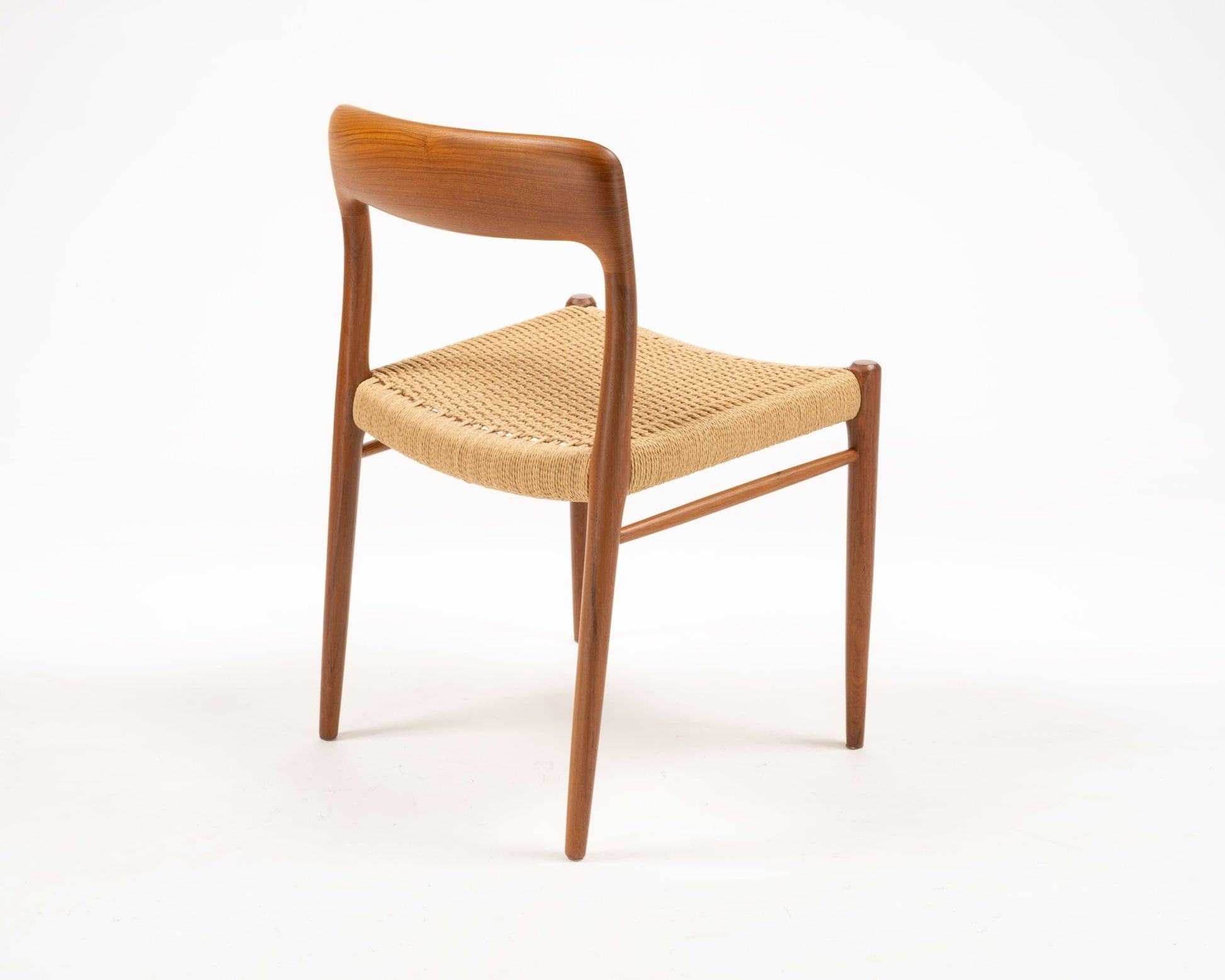 Niels Otto Moller Model 56 Danish teak dining chair with woven papercord seat from the 1960s, side view on white background