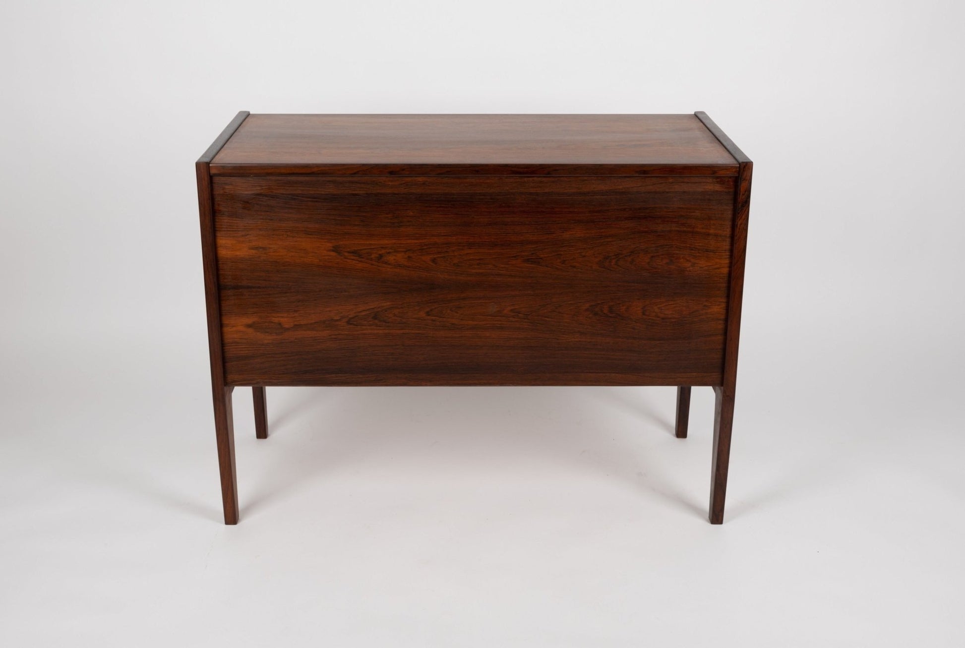 Nils Jonsson 1960s Danish chest of drawers with three recessed handle drawers and tapered legs by HJN Mobler
