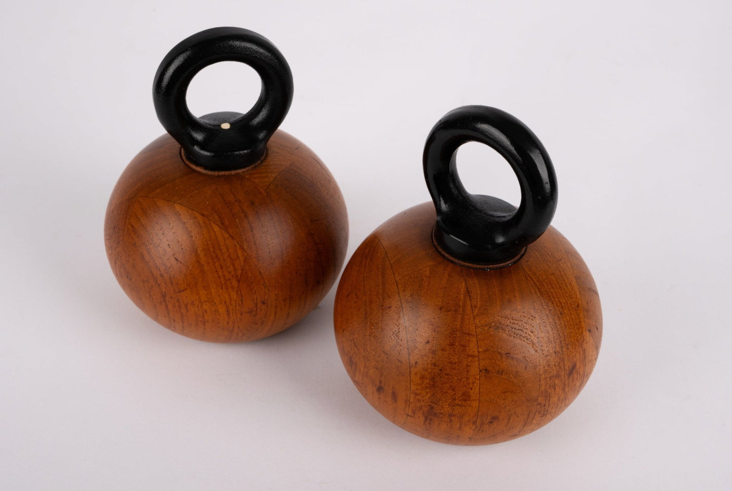 Pair of Nissen & Jorgensen 1960s Danish salt and pepper mills with solid teak bodies and black rounded iron handles