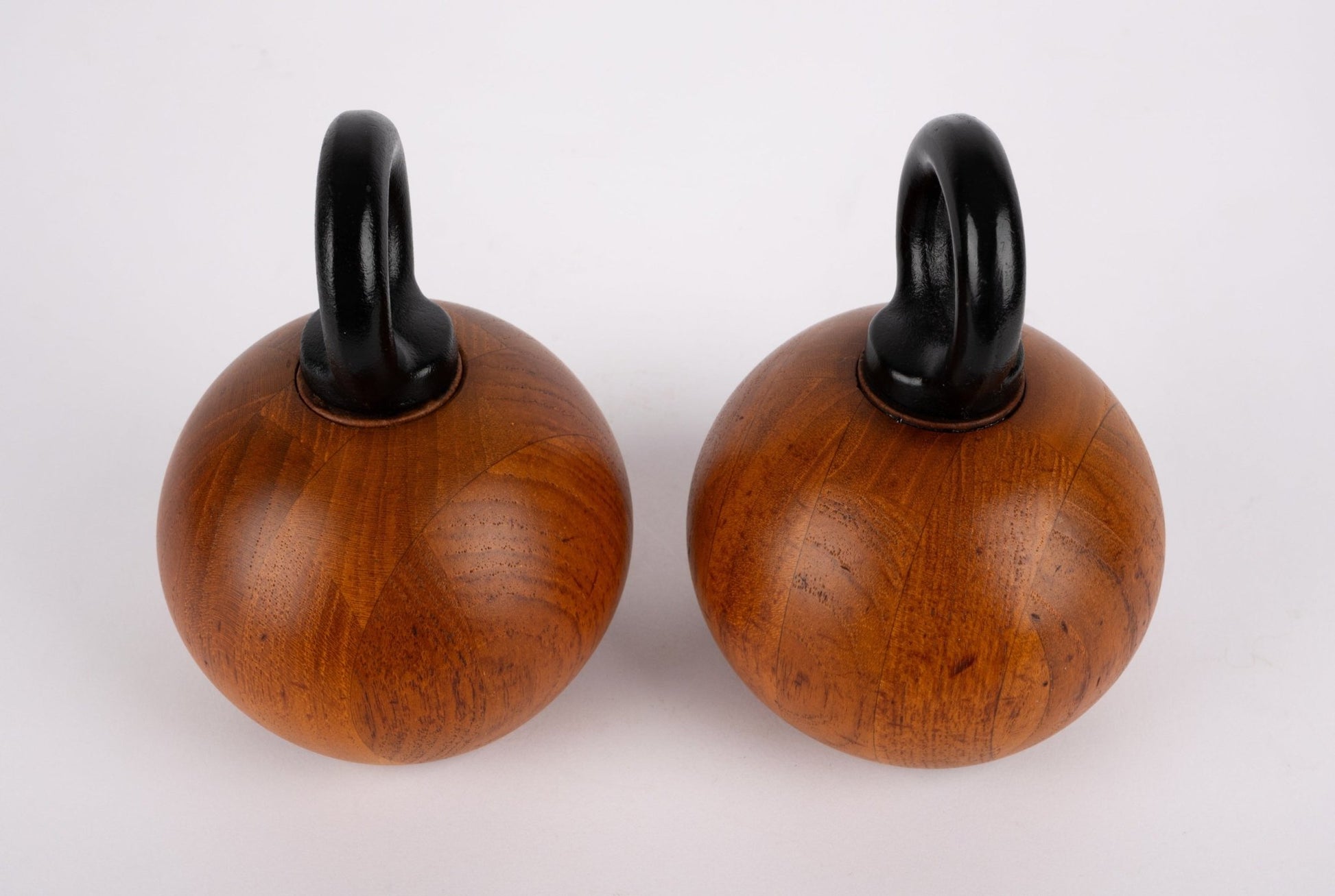 Pair of 1960s Nissen & Jorgensen salt and pepper mills with solid teak bodies and rounded black iron handles from Denmark.
