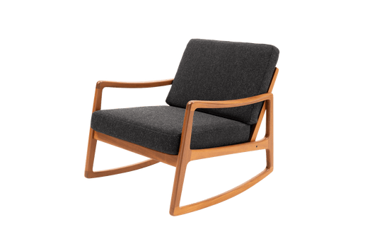 Ole Wanscher mid-century modern teak rocking chair with sculpted armrests and dark upholstered cushions.