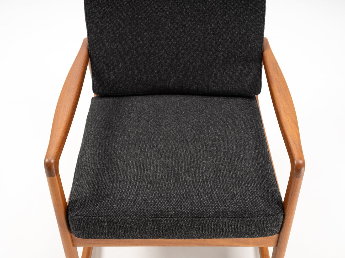 Ole Wanscher mid-century modern rocking chair with solid teak frame and dark gray upholstered seat and backrest