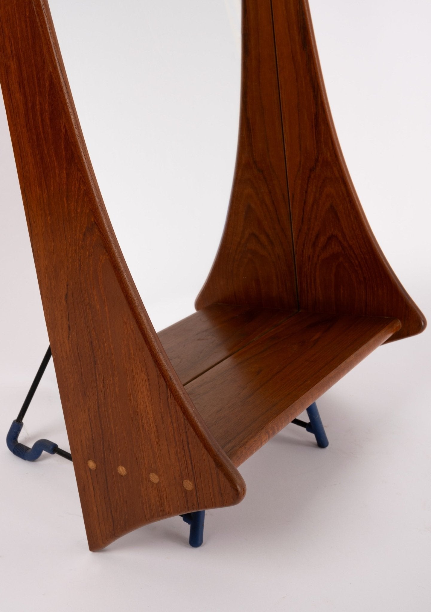 Close-up of sculpted teak frame and dowel joinery on Pedersen & Hansen 1960s Danish wall mirror