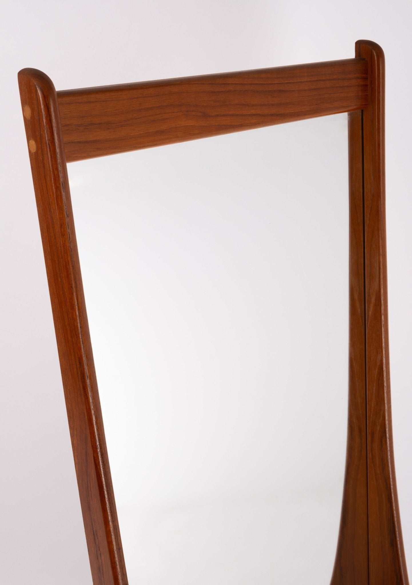 1960s mid-century modern wall mirror with sculpted teak frame and visible dowel joinery detail from Denmark