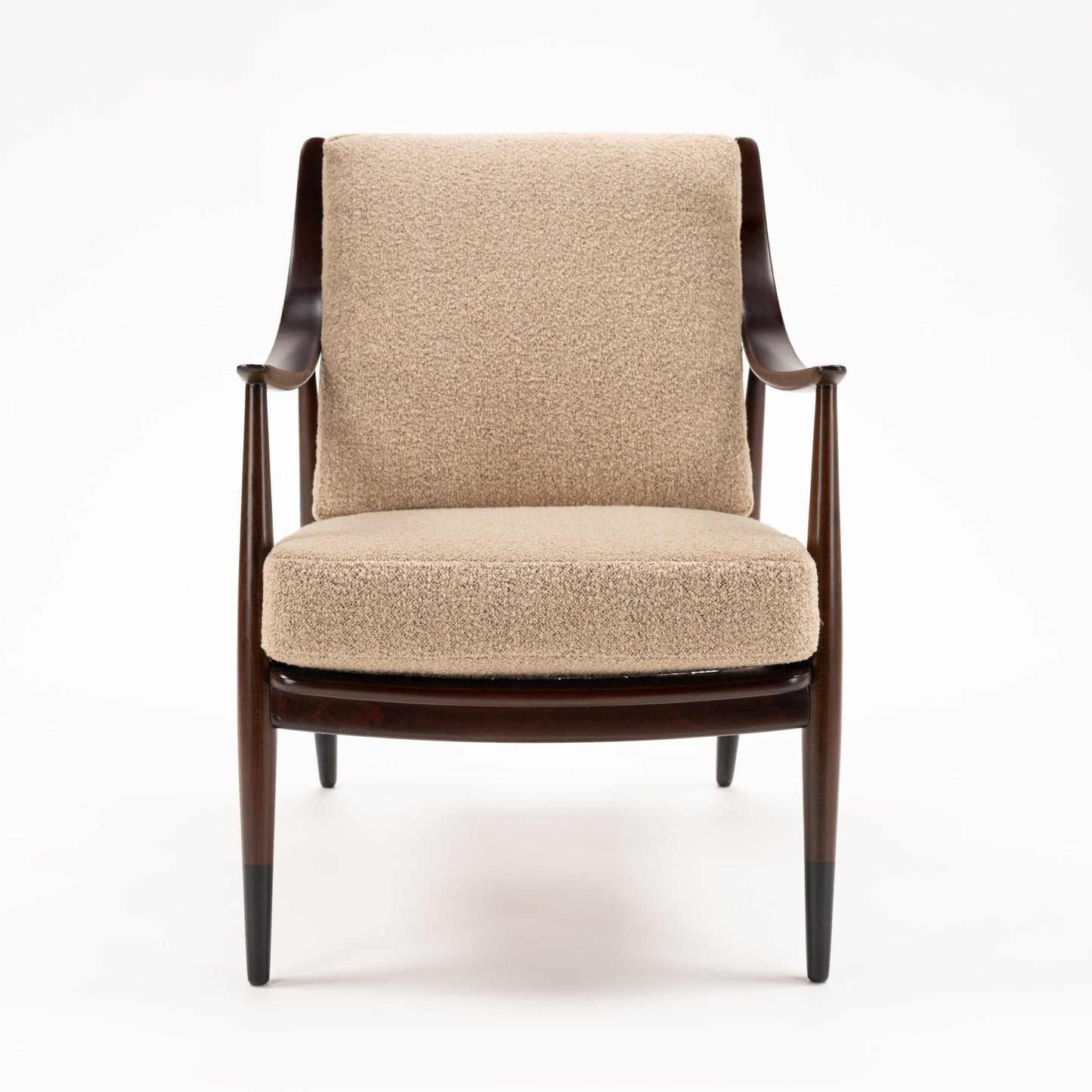 Peter Hvidt Model FD 145 Lounge Chair with dark sculpted wood frame curved arms tapered legs and textured beige upholstery in vintage Danish furniture style