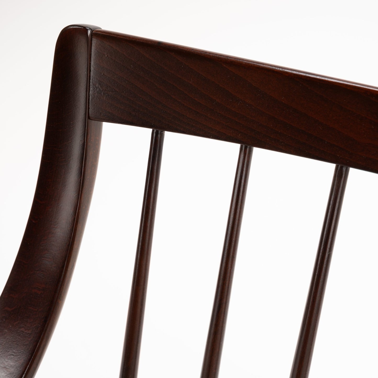 Peter Hvidt Model FD 145 Lounge Chair close detail of dark sculpted wood back rail and vertical spindles in vintage Danish furniture style
