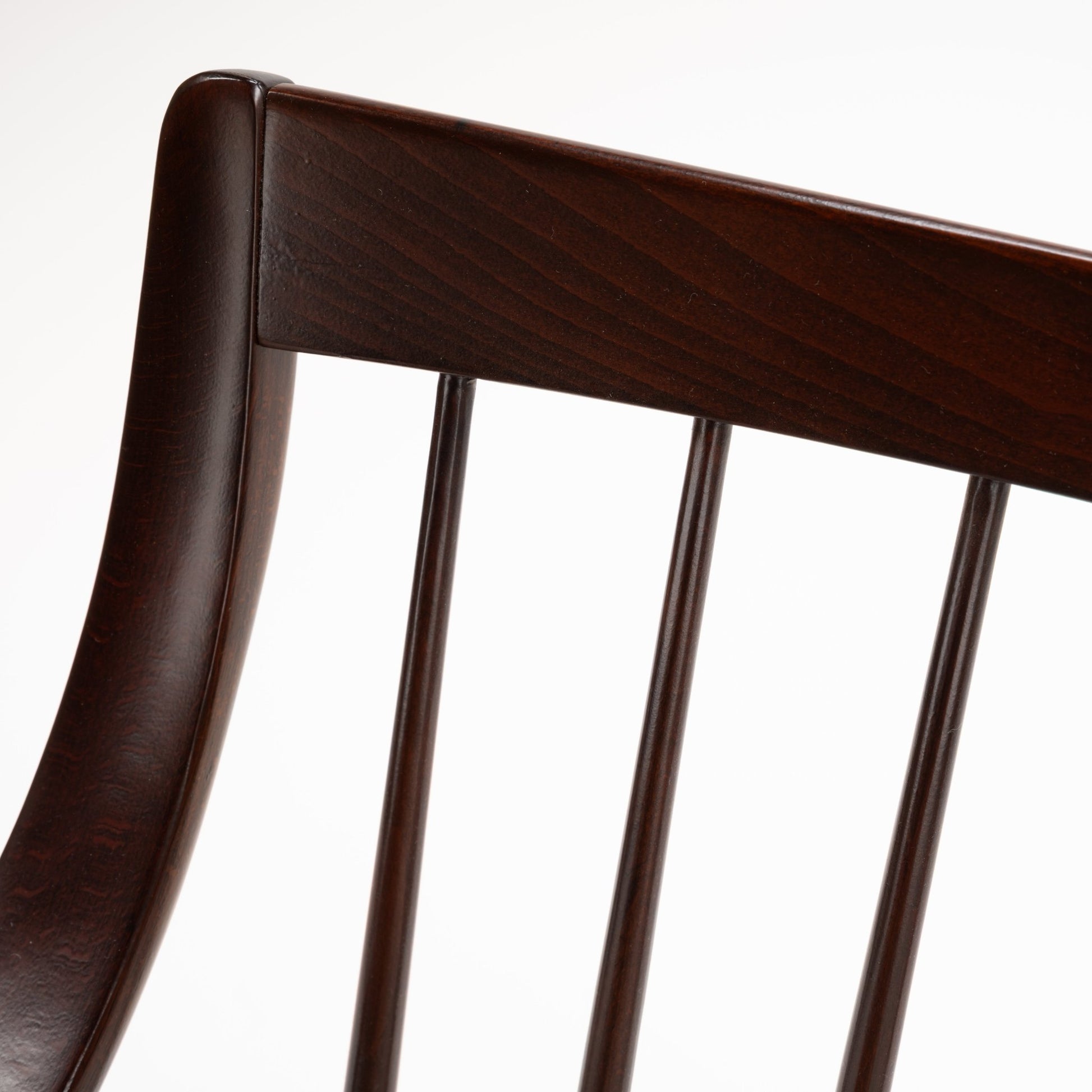 Peter Hvidt Model FD 145 Lounge Chair close detail of dark sculpted wood back rail and vertical spindles in vintage Danish furniture style
