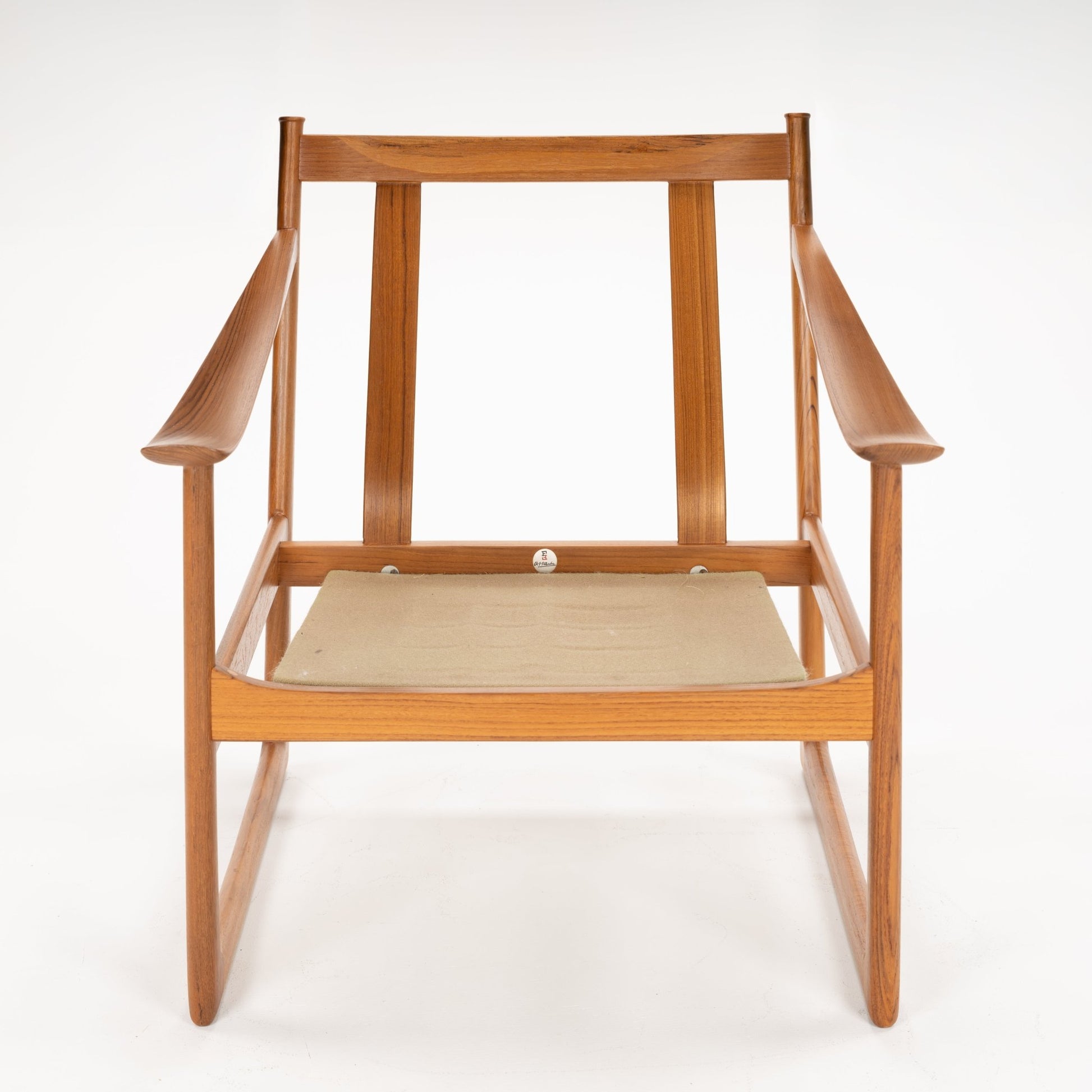 Front view of a wooden chair frame with angled armrests and a beige fabric seat sling against a white background