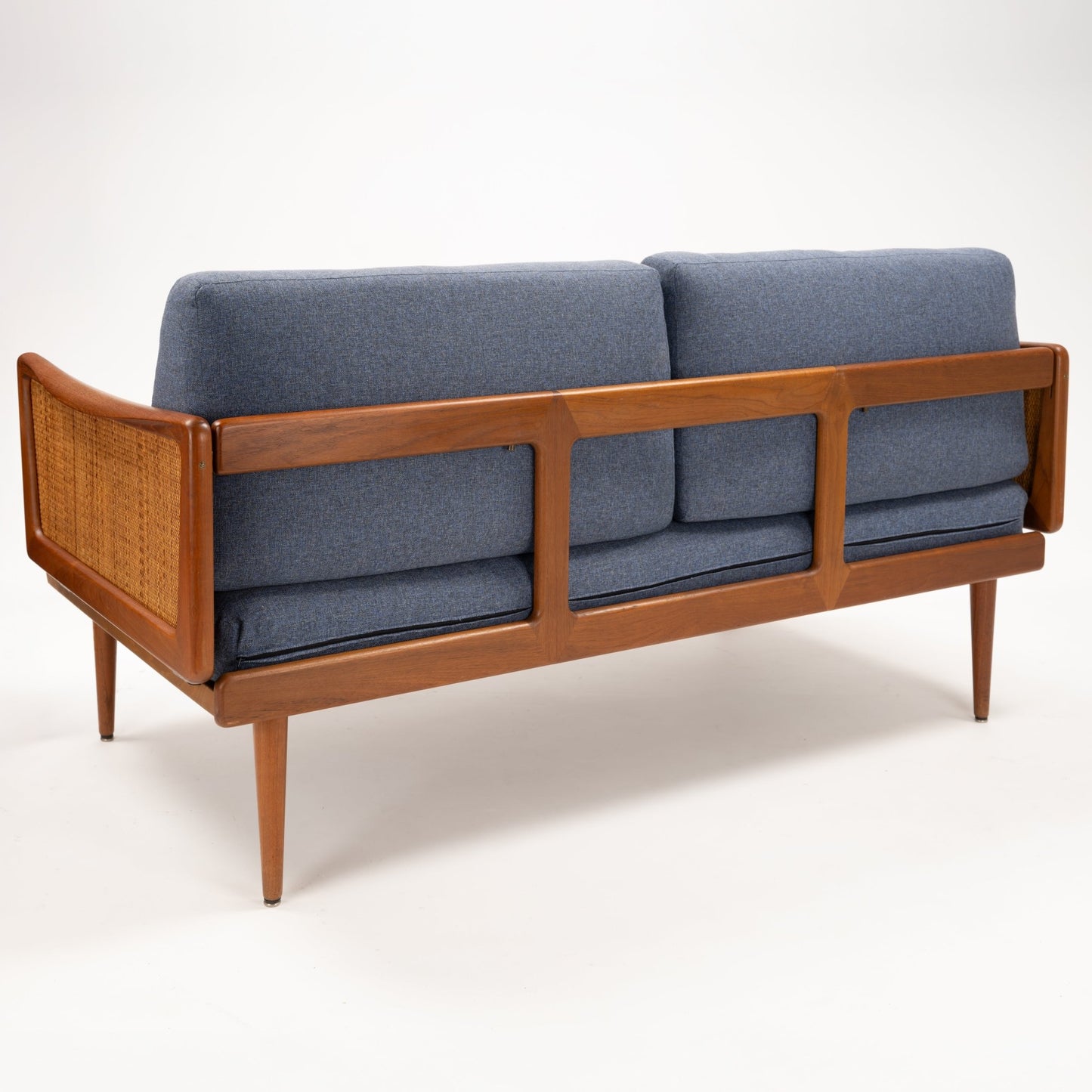 Peter Hvidt & Orla Molgaard Model FD 451 Daybed/Sofa with blue cushions teak frame woven cane side panels and tapered legs in vintage danish furniture style