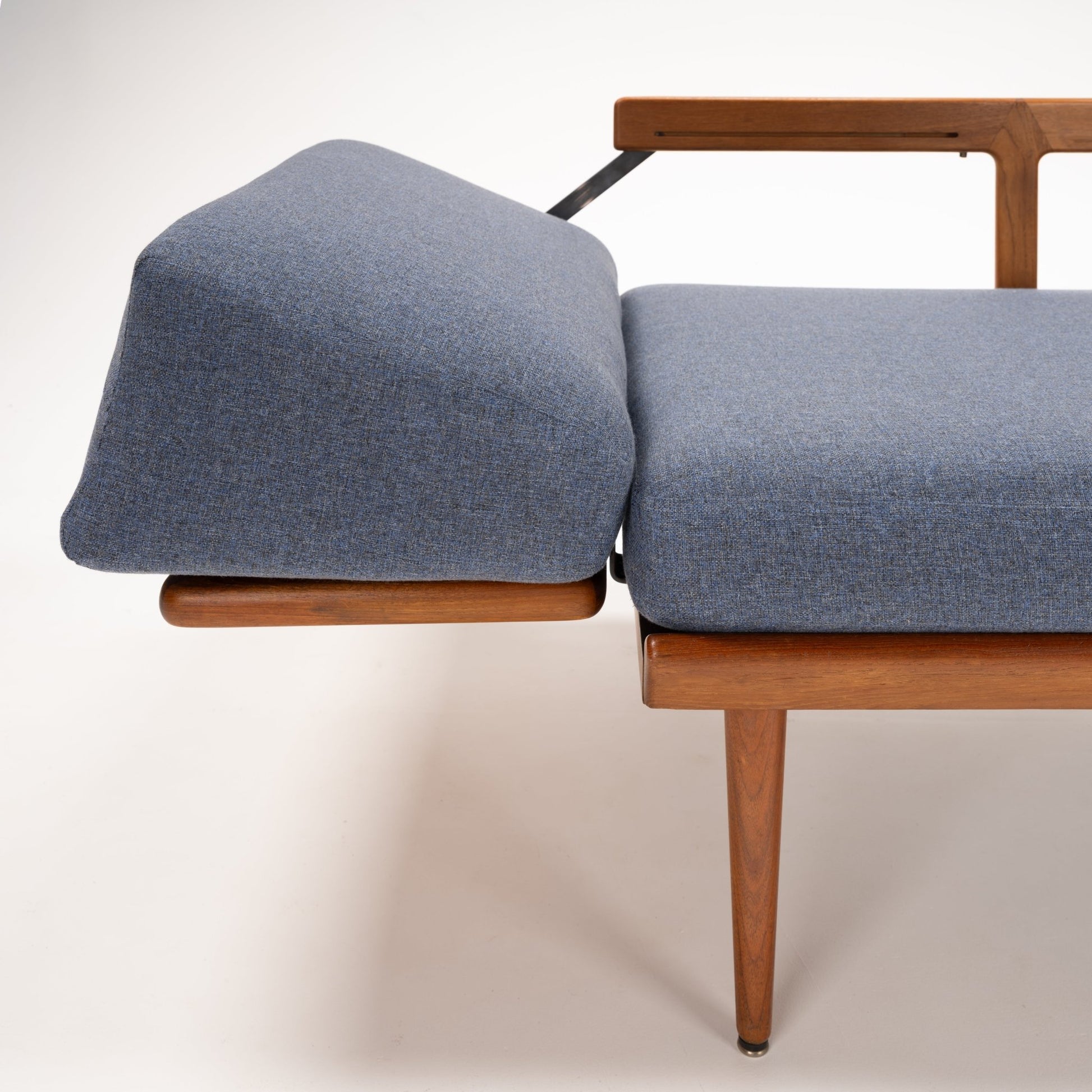 Peter Hvidt & Orla Molgaard Model FD 451 Daybed/Sofa side detail with blue upholstery teak armrest and tapered leg in vintage Danish furniture style