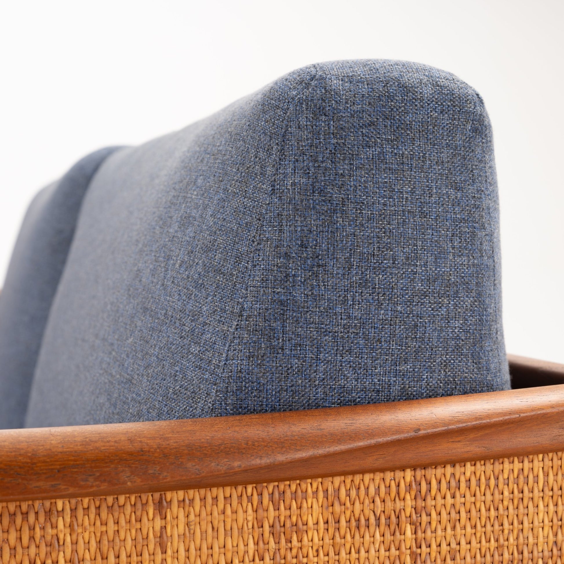 Peter Hvidt & Orla Molgaard Model FD 451 Daybed/Sofa close up of blue upholstery teak armrest and woven cane panel in vintage Danish furniture style