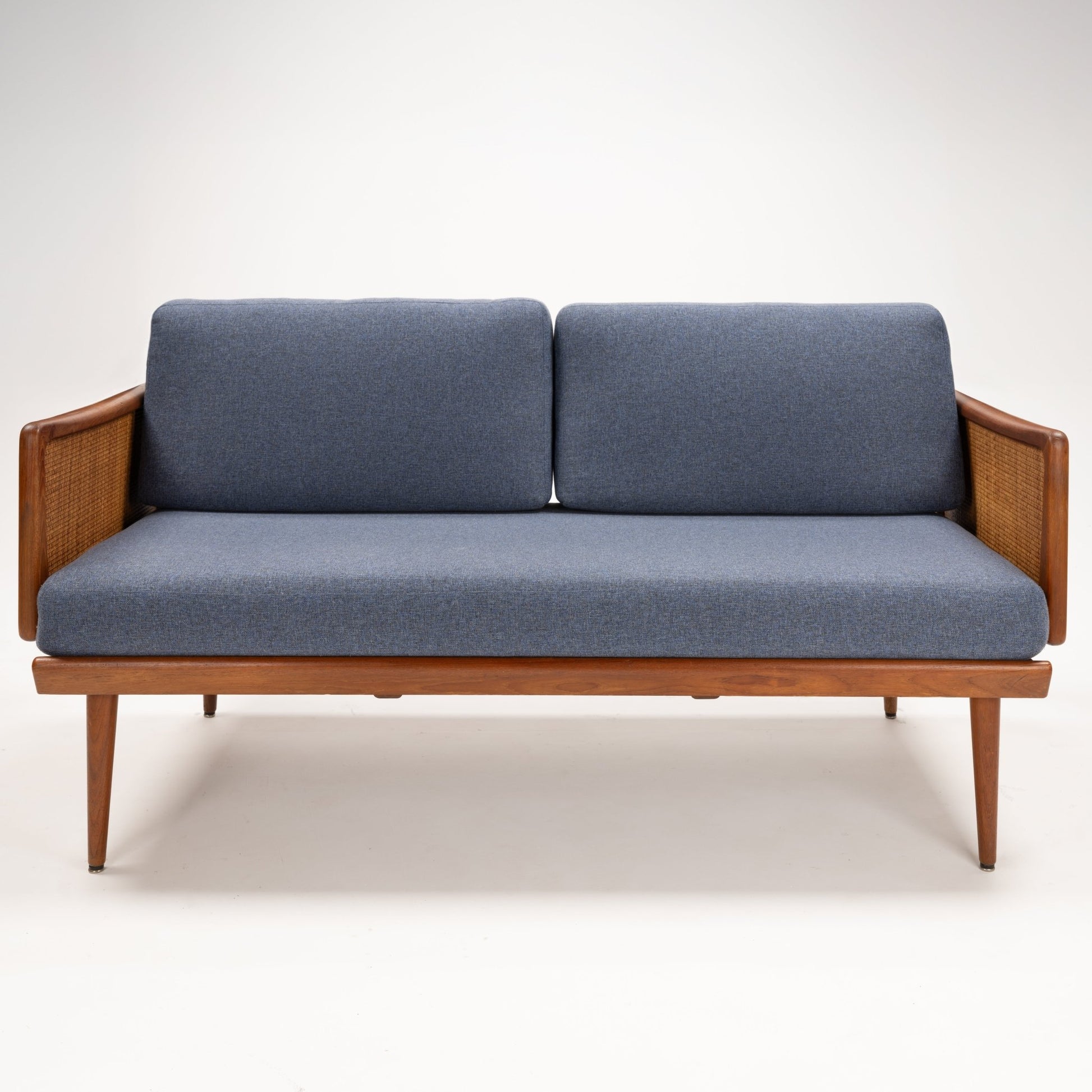 Peter Hvidt & Orla Molgaard Model FD 451 Daybed/Sofa with slate blue cushions woven wood armrests and tapered teak legs in vintage Danish furniture style