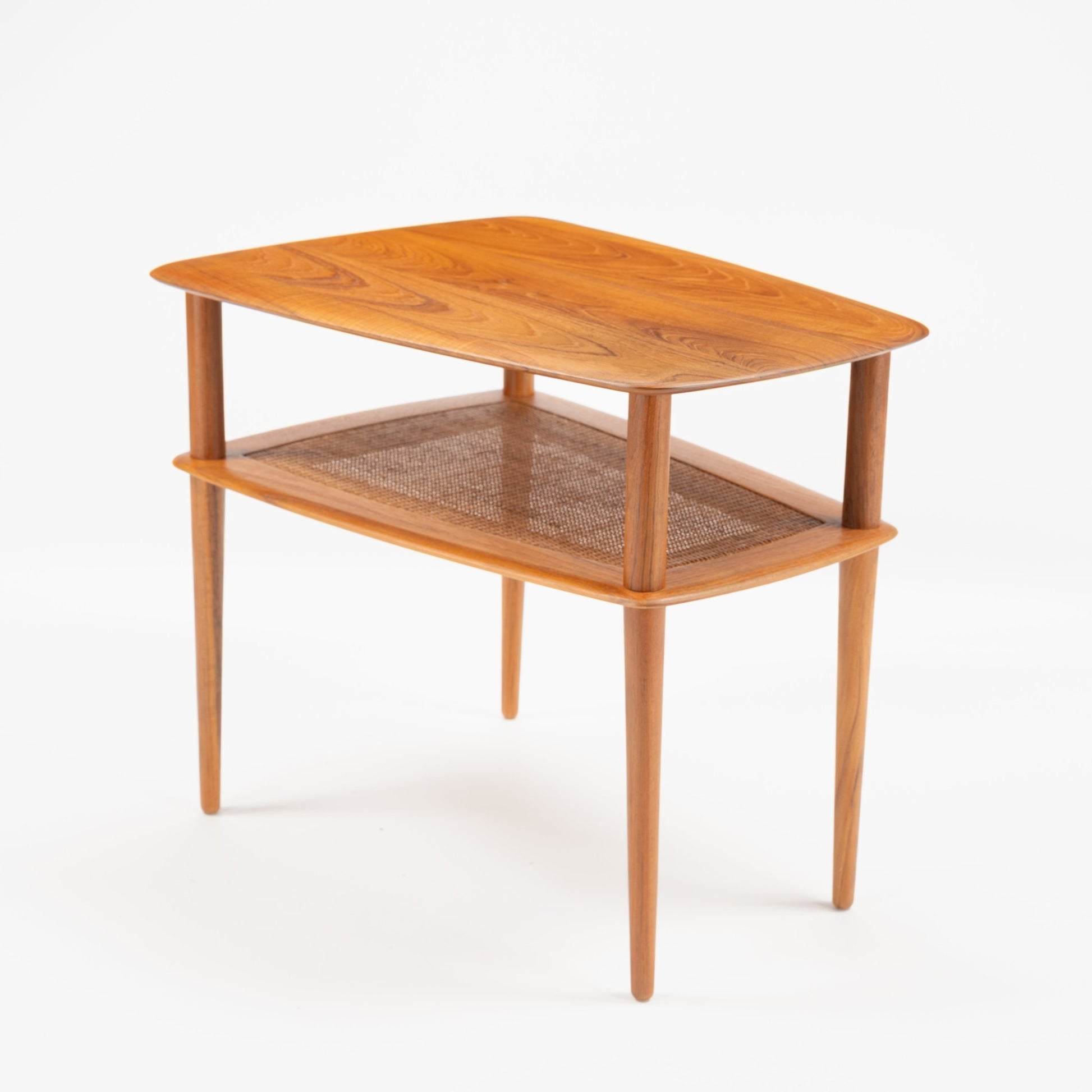 Peter Hvidt & Orla Molgaard Pair of End Tables featuring a smooth wooden top with visible grain, a woven shelf below, and slender tapered legs in classic mid century modern style.
