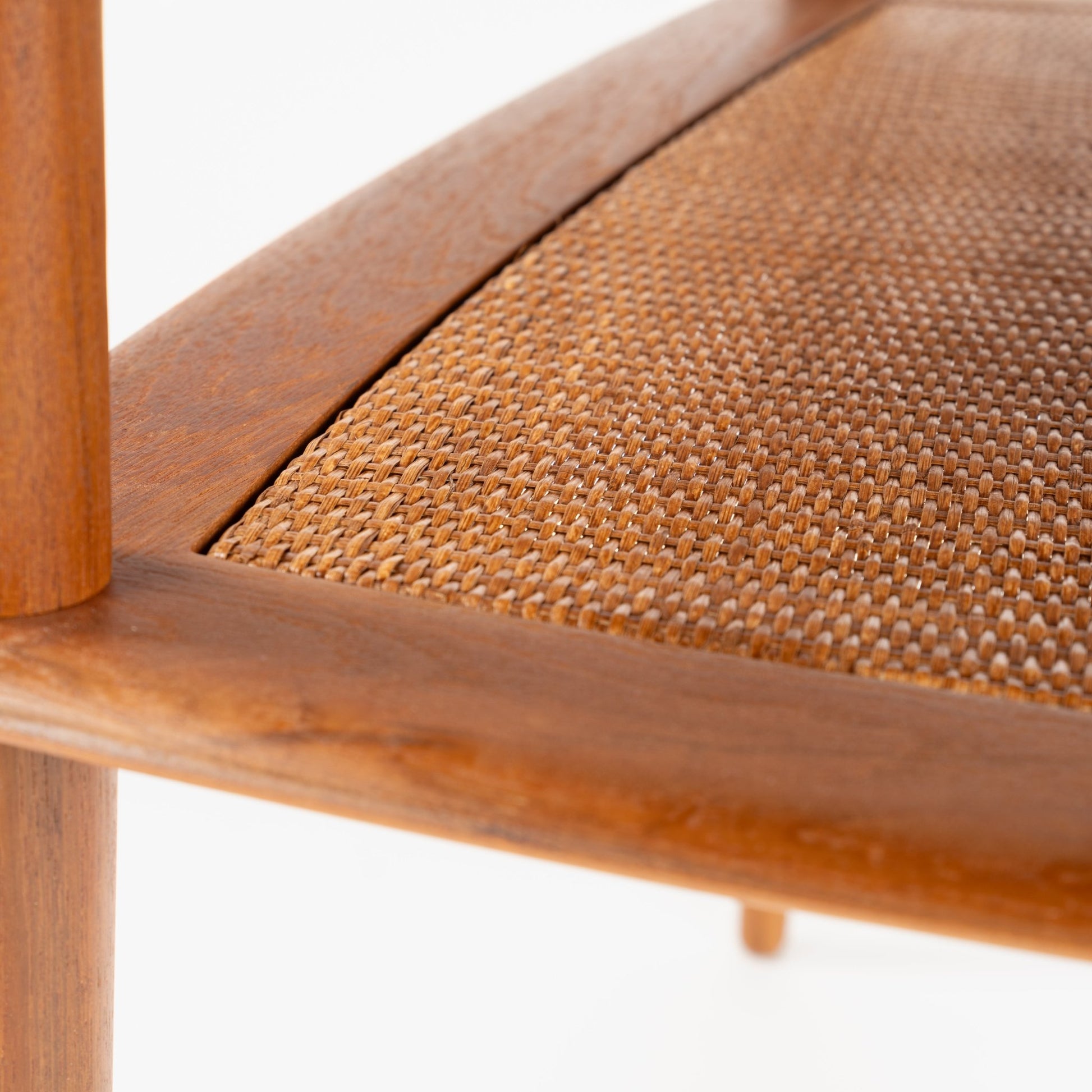 Peter Hvidt & Orla Molgaard Pair of End Tables showcasing a finely crafted wooden frame with a close-up of the woven cane lower shelf, reflecting mid century modern design.