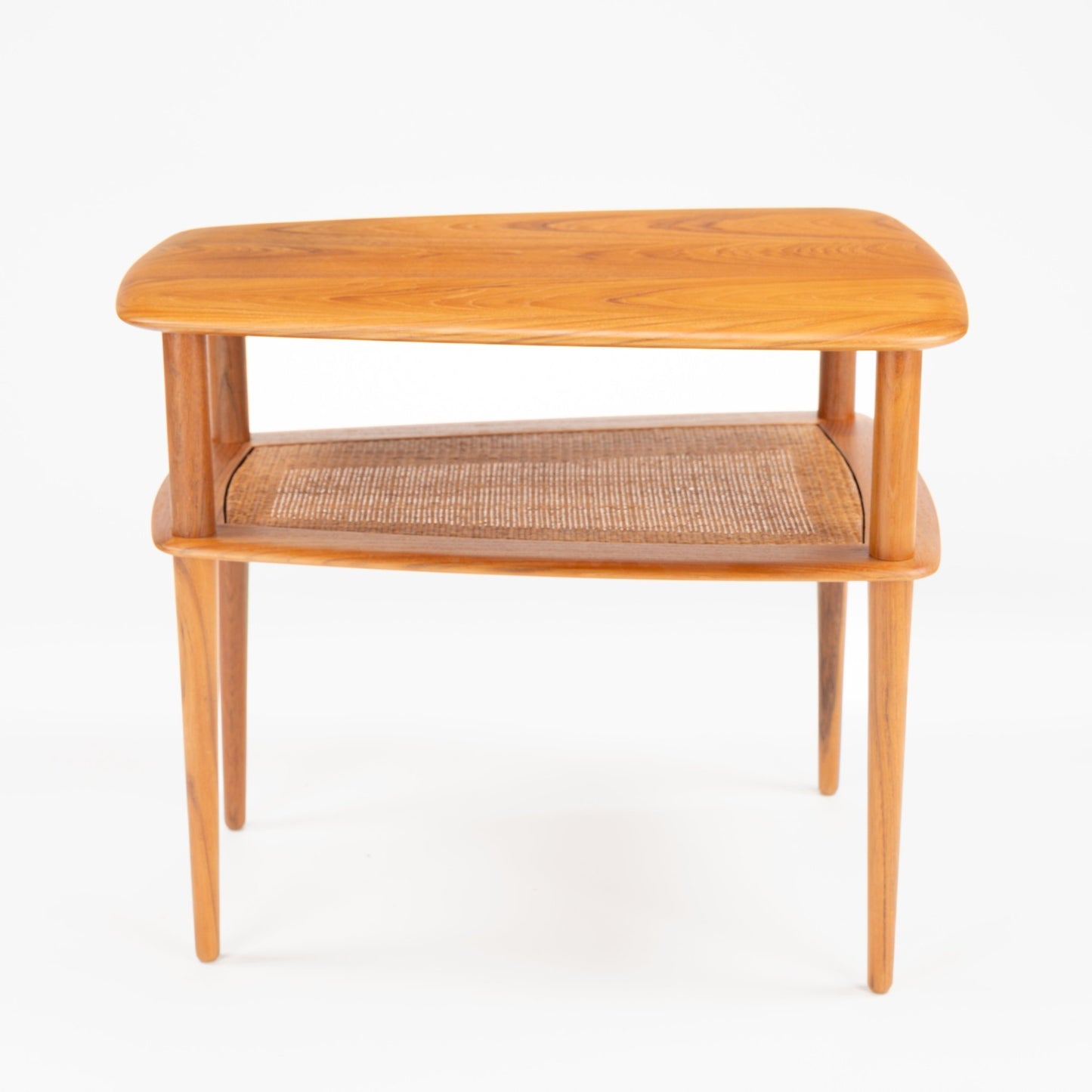 Peter Hvidt & Orla Molgaard Pair of End Tables with a smooth wooden top highlighting natural grain, open woven cane shelf below, and tapered legs in elegant mid century modern style.