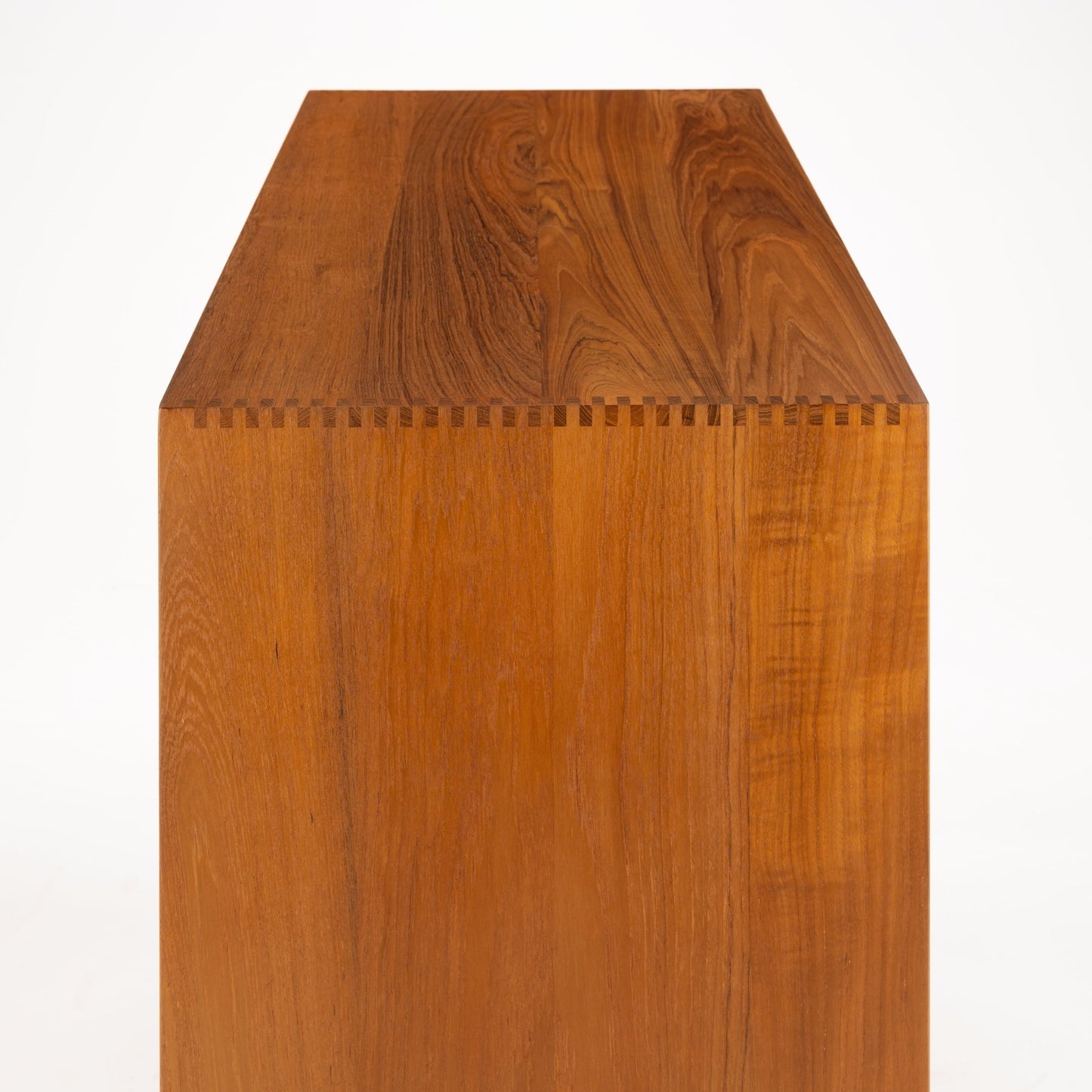 Peter Hvidt & Orla Nielsen Teak Chest of Drawers showing a close-up of the top corner with precise dovetail joinery and rich teak wood grain in vintage Danish mid century modern style.