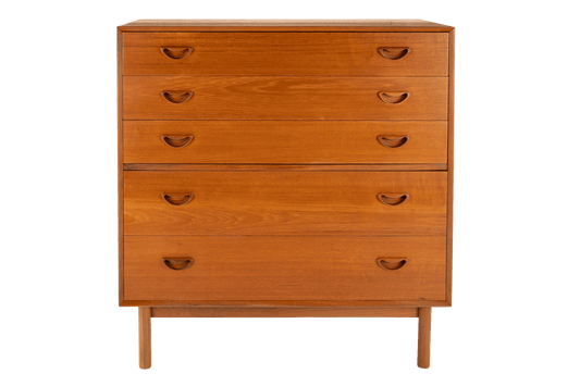 Peter Hvidt & Orla Nielsen Teak Chest of Drawers featuring warm teak wood with five drawers, curved recessed handles, and a clean-lined design embodying vintage Danish mid century modern storage furniture.