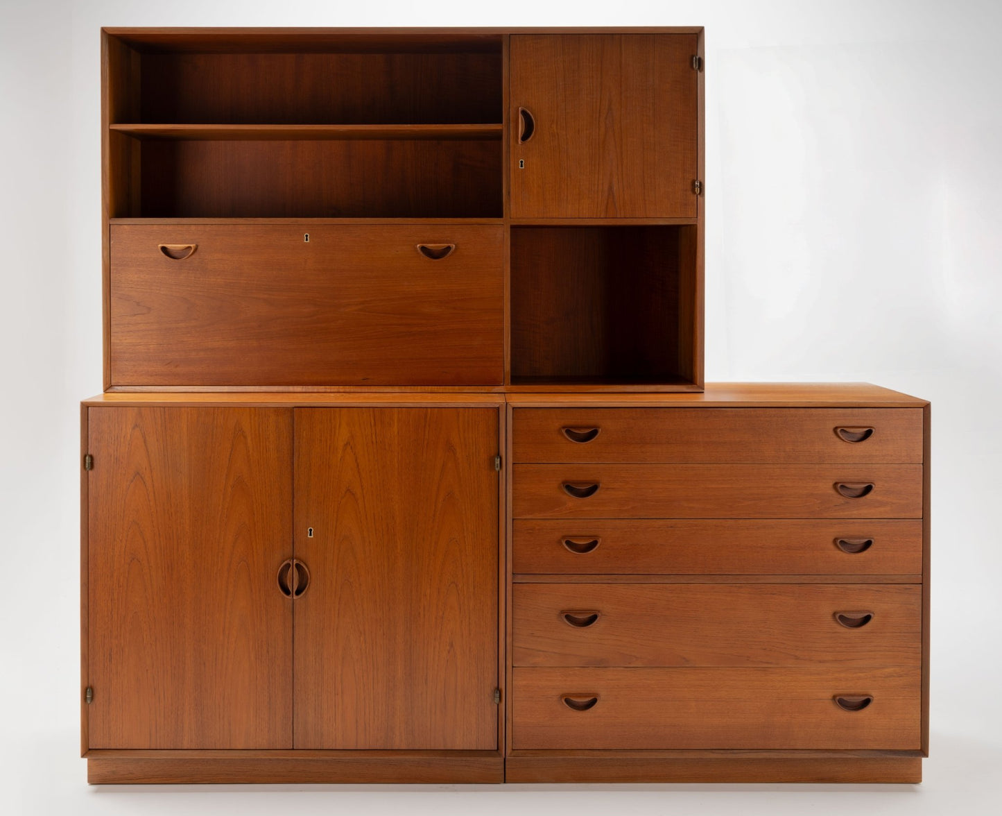 Peter Hvidt solid teak Danish grouping with five-drawer dresser, two-door cabinet, and drop-down bar/desk unit
