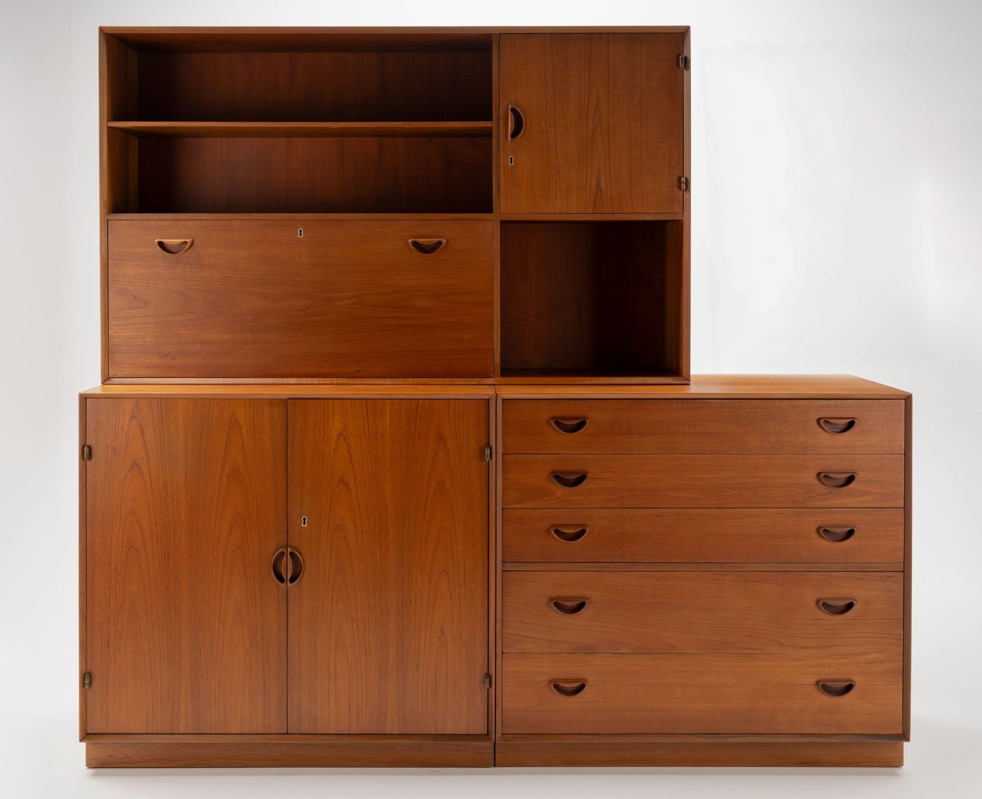 Peter Hvidt solid teak Danish grouping with five-drawer dresser, two-door cabinet, and drop-down bar/desk unit