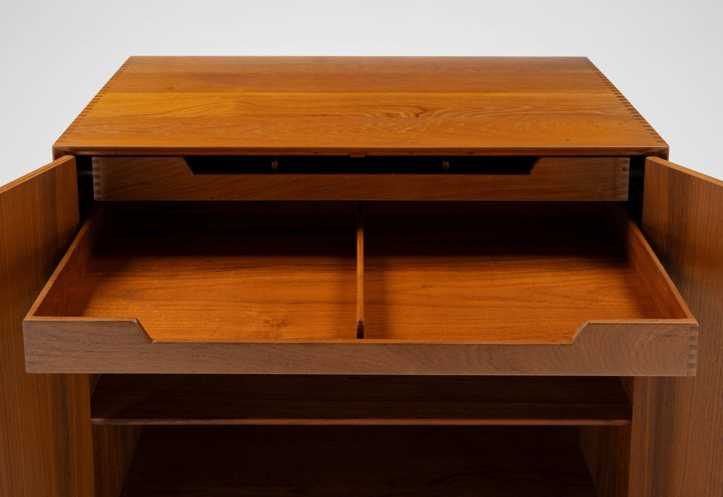 Peter Hvidt mid-century modern solid teak cabinet with open drawers showcasing Scandinavian craftsmanship