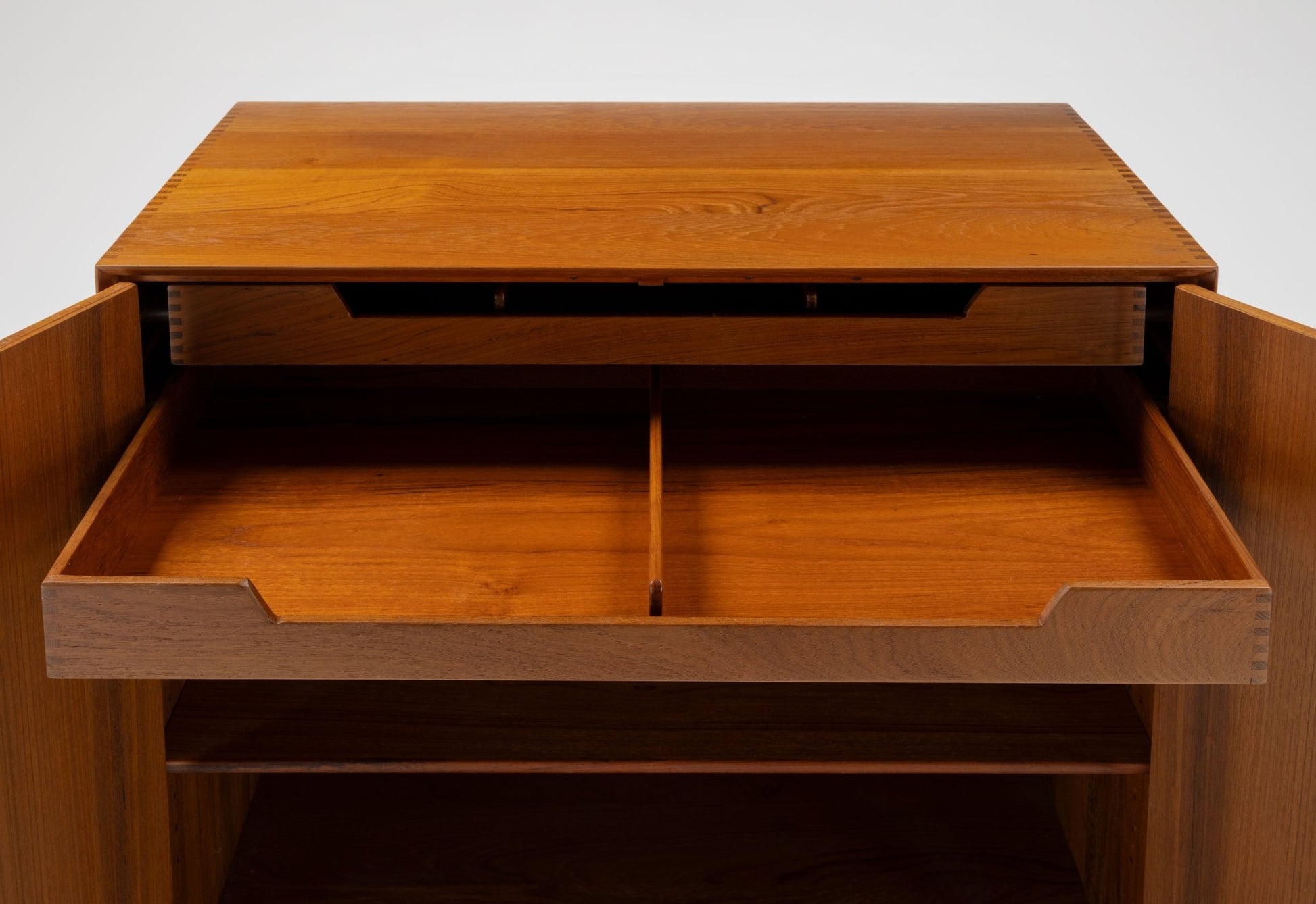 Peter Hvidt mid-century modern solid teak cabinet with open drawers showcasing Scandinavian craftsmanship