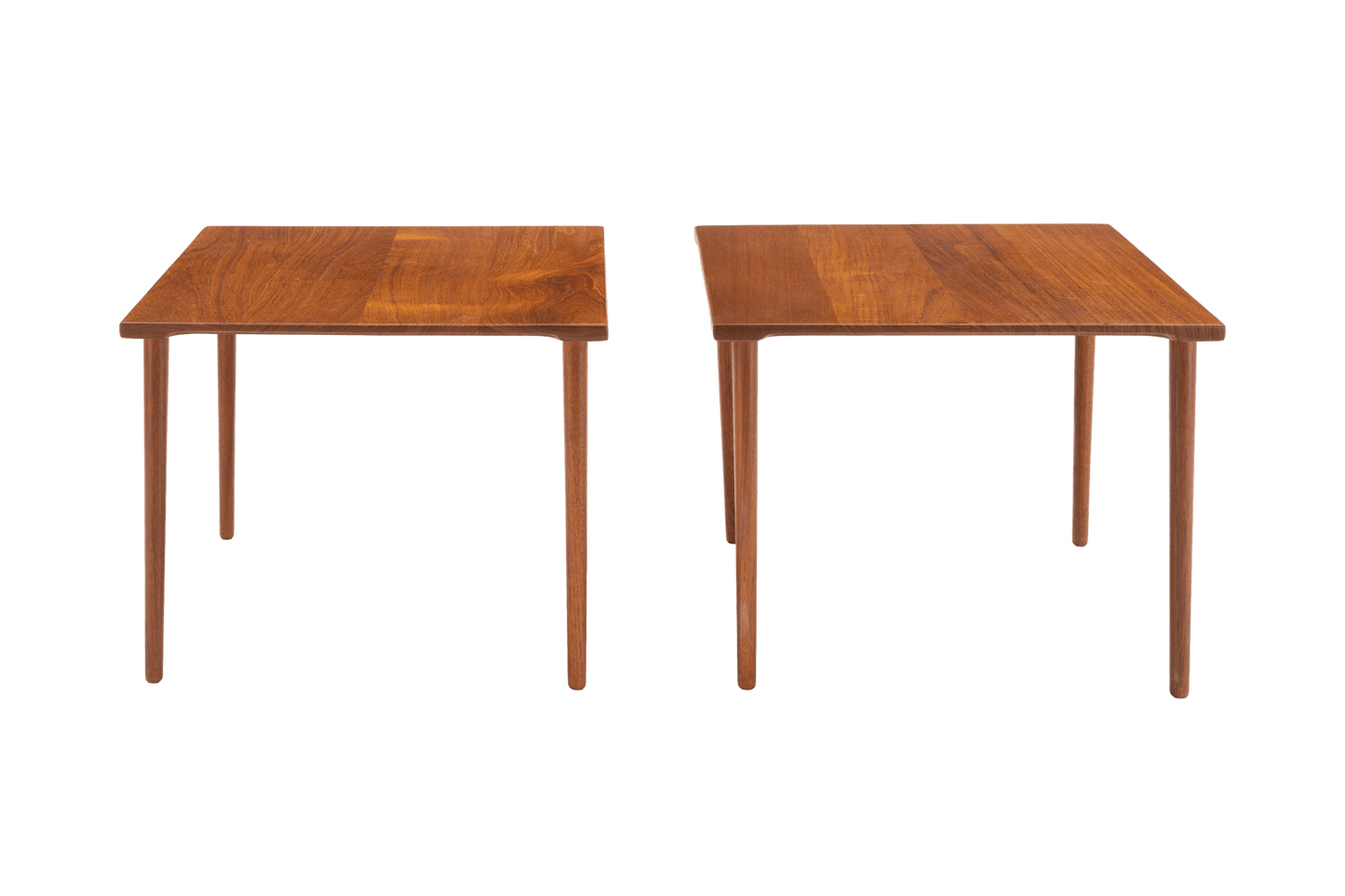 Pair of 1960s Peter Hvidt solid teak side tables with slender dowel legs and richly grained tops on white background
