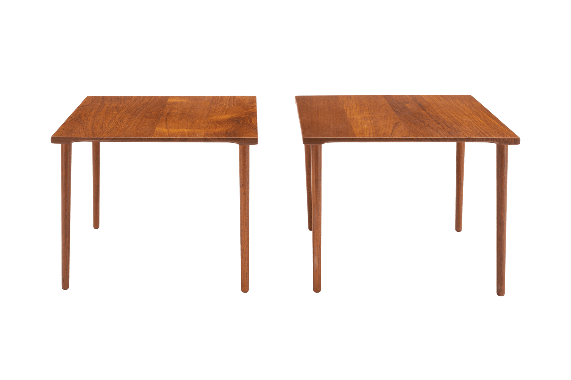 Pair of 1960s Peter Hvidt solid teak side tables with slender dowel legs and richly grained tops on white background