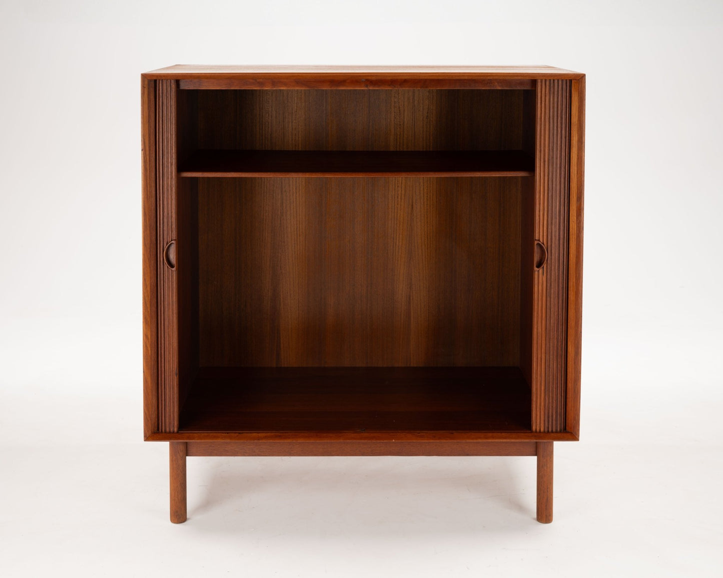 Peter Hvidt Danish teak tambour door cabinet from the 1950s with clean lines and minimalist design