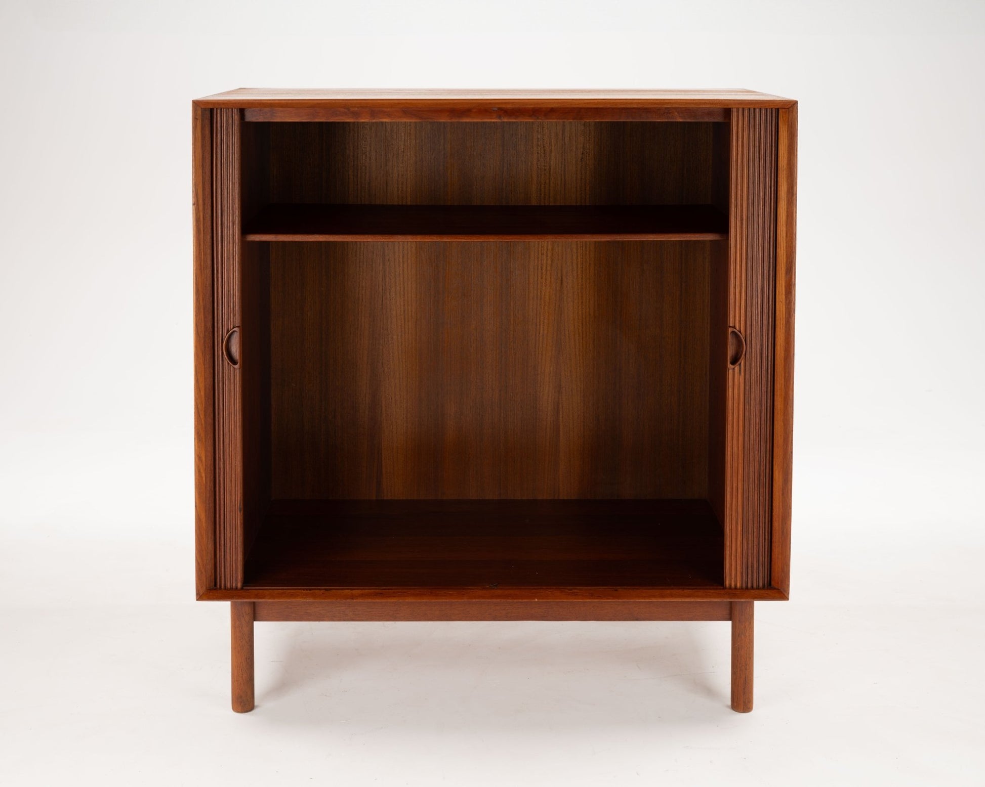 Peter Hvidt Danish teak tambour door cabinet from the 1950s with clean lines and minimalist design