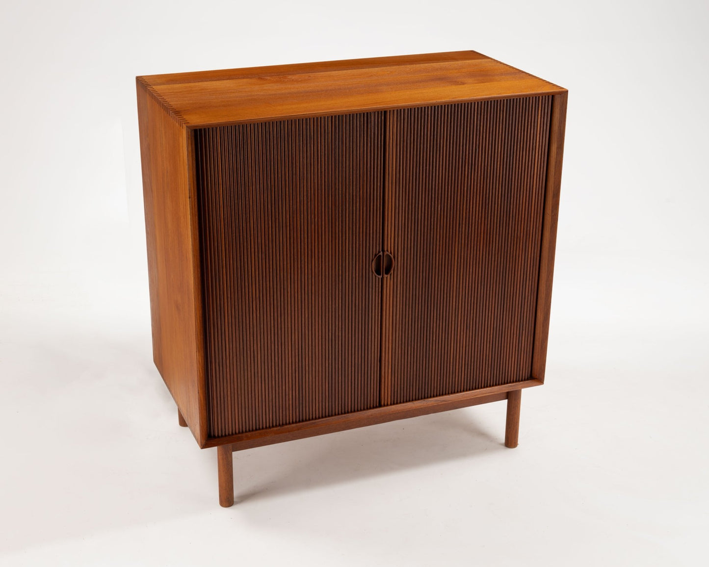 Peter Hvidt teak tambour door cabinet from the late 1950s with clean lines by Danish designers for Søborg Møbler